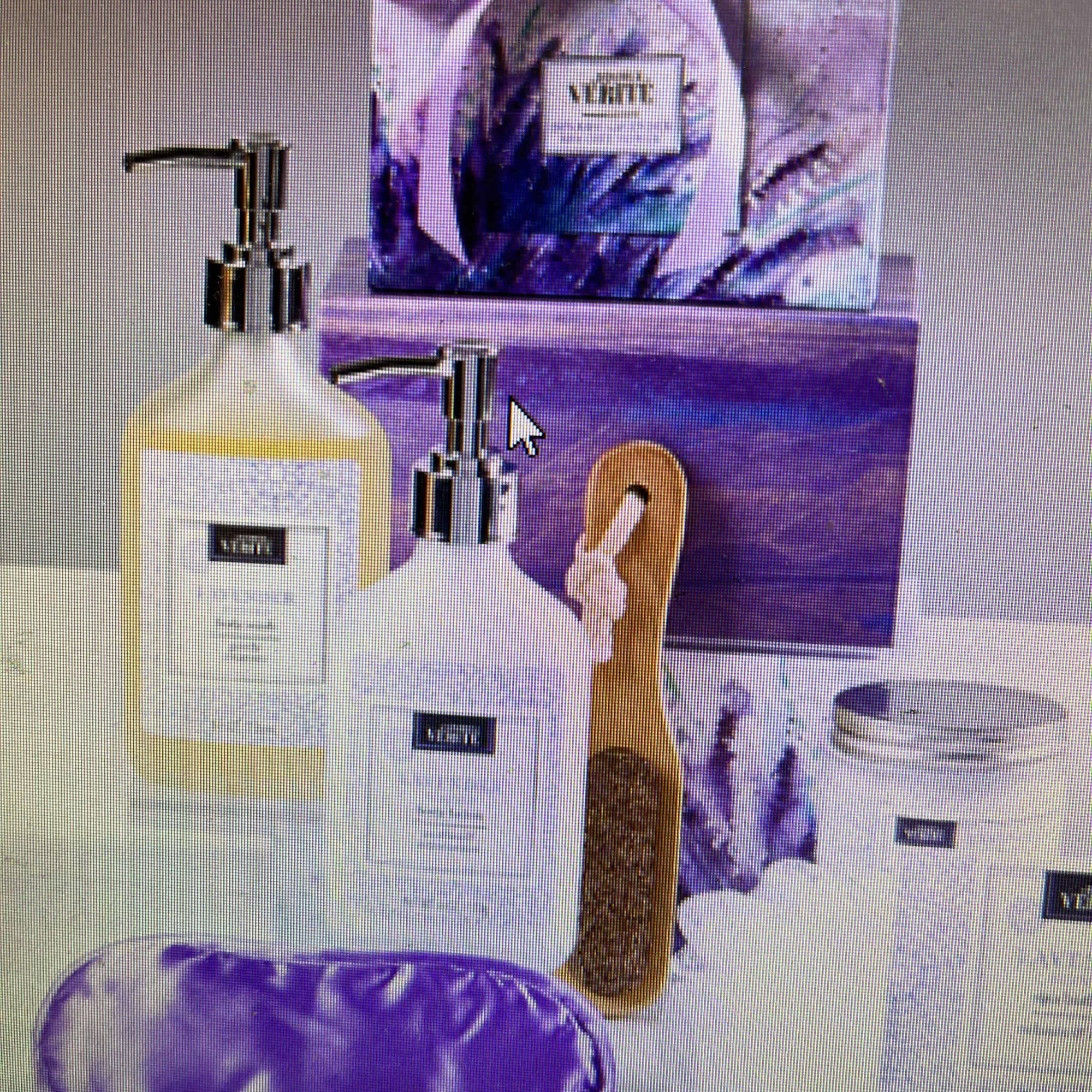 Purple bath gift set with soap dispensers, brush, and wrapped package