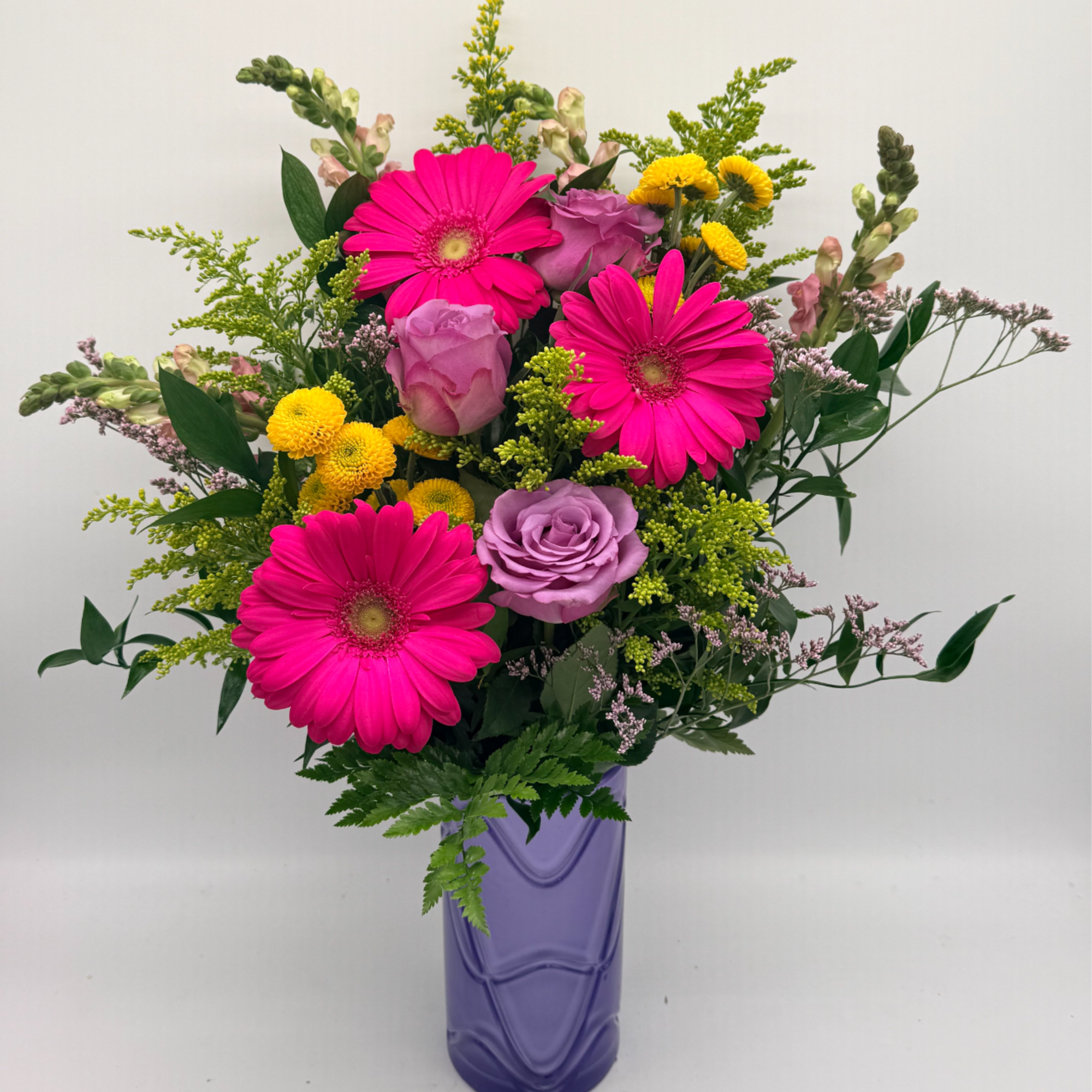 A fun and flirty mix arranged in a stylish vase. This design