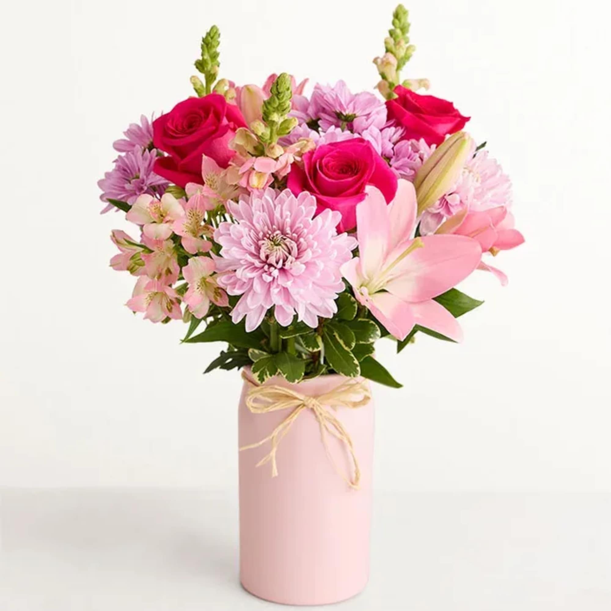 Bright pink roses and pale pink lilies give this Mother's Embrace 2