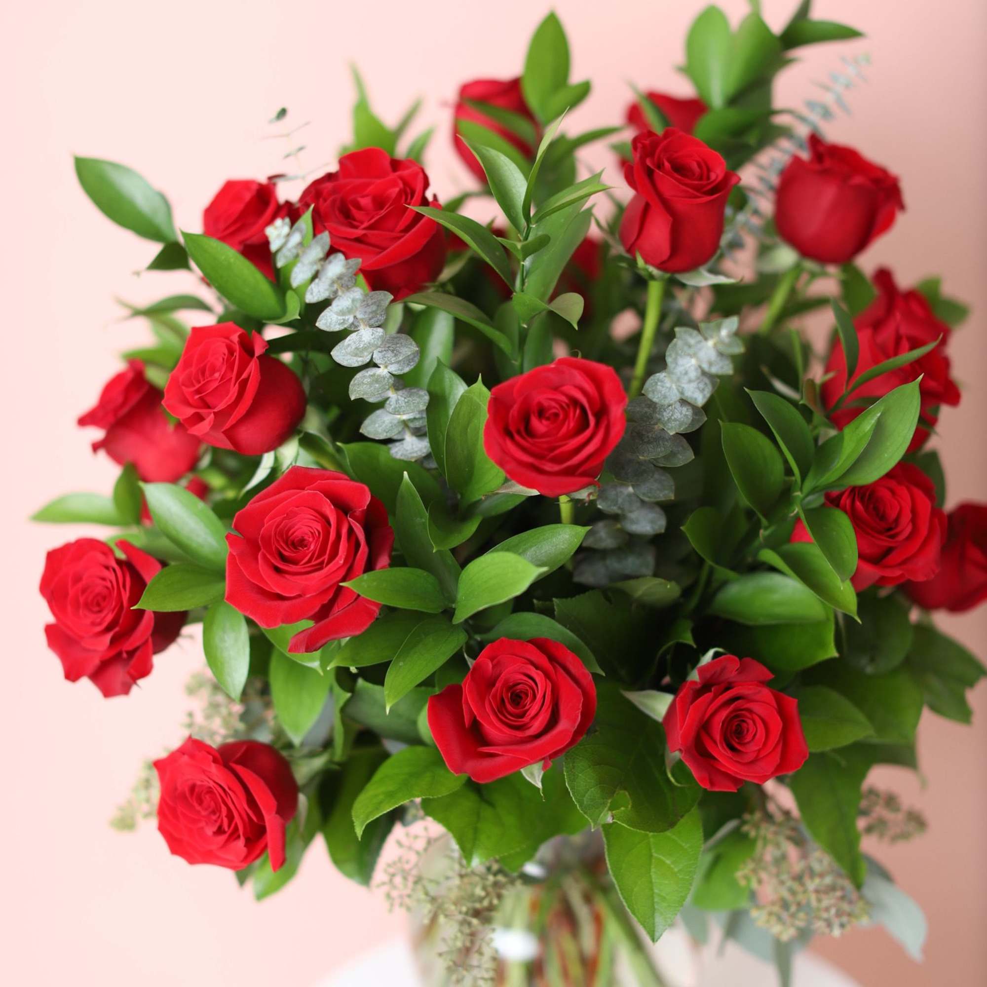 Bouquet of red roses in a clear glass vase