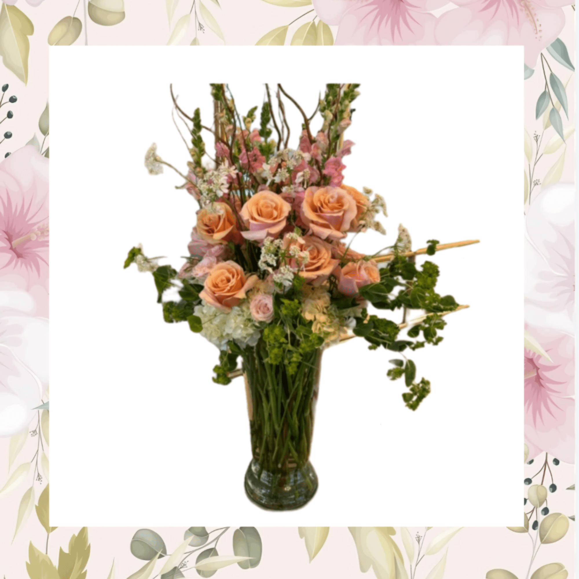 Peach roses and pink flowers arranged in a glass vase