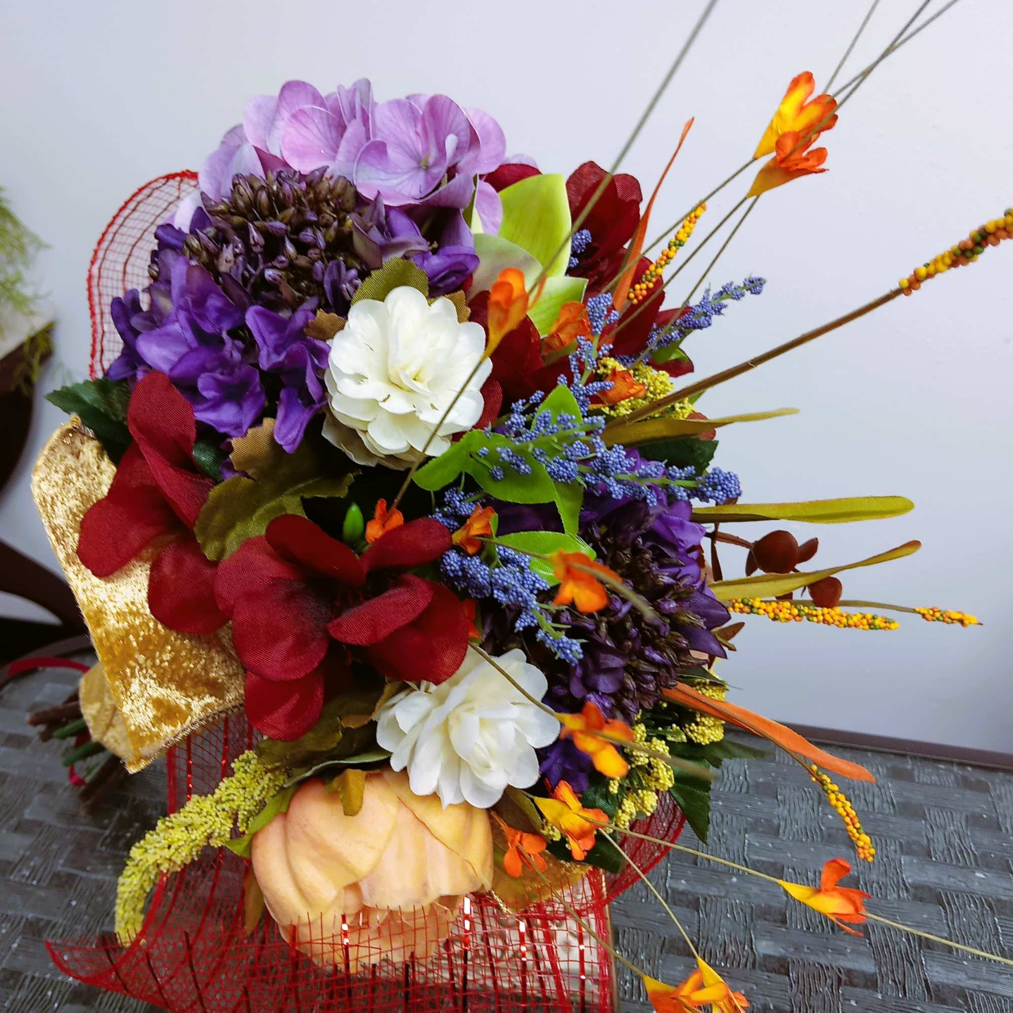 Colorful bouquet with purple, white, and orange flowers