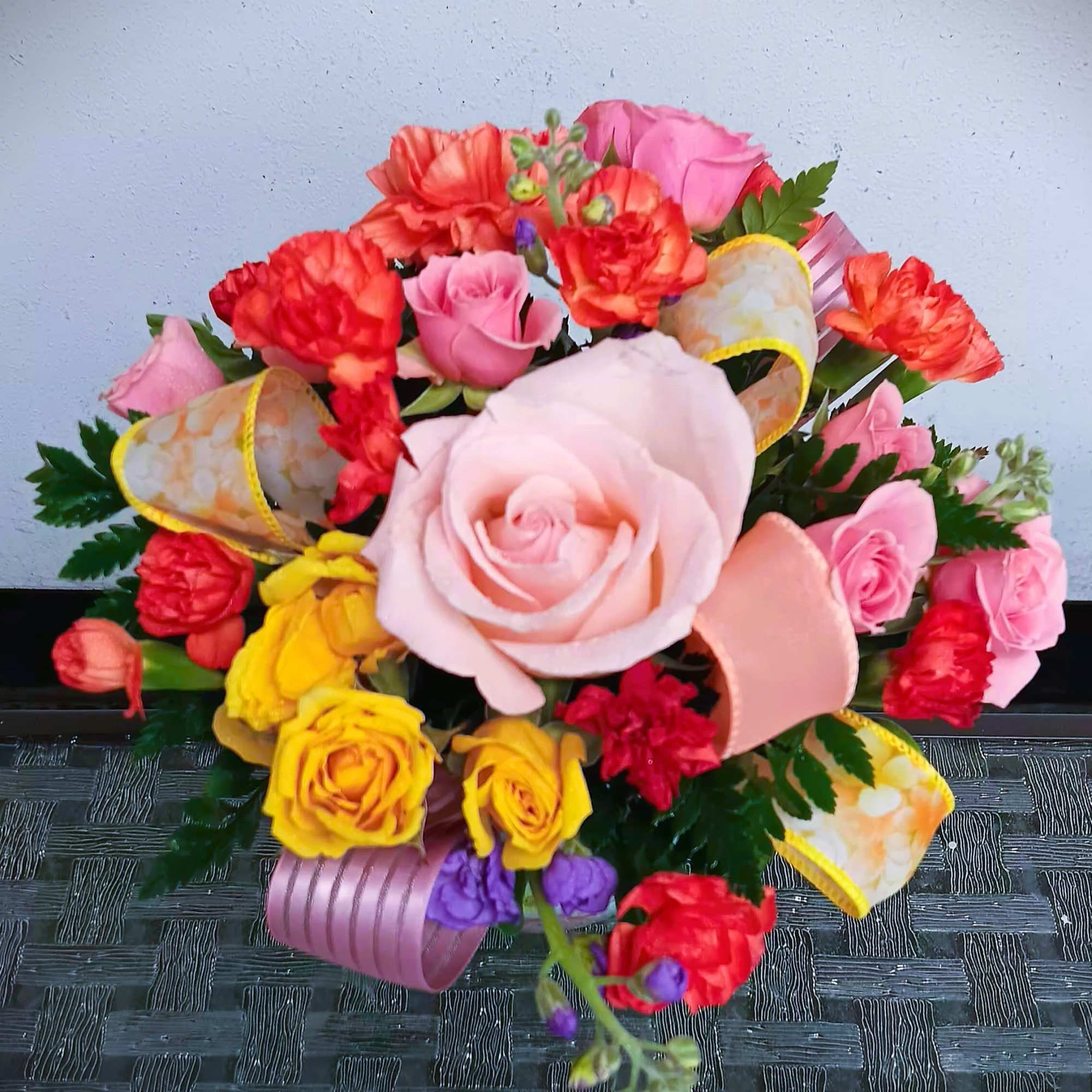 This cute fresh floral arrangement in keepsake container is great for many