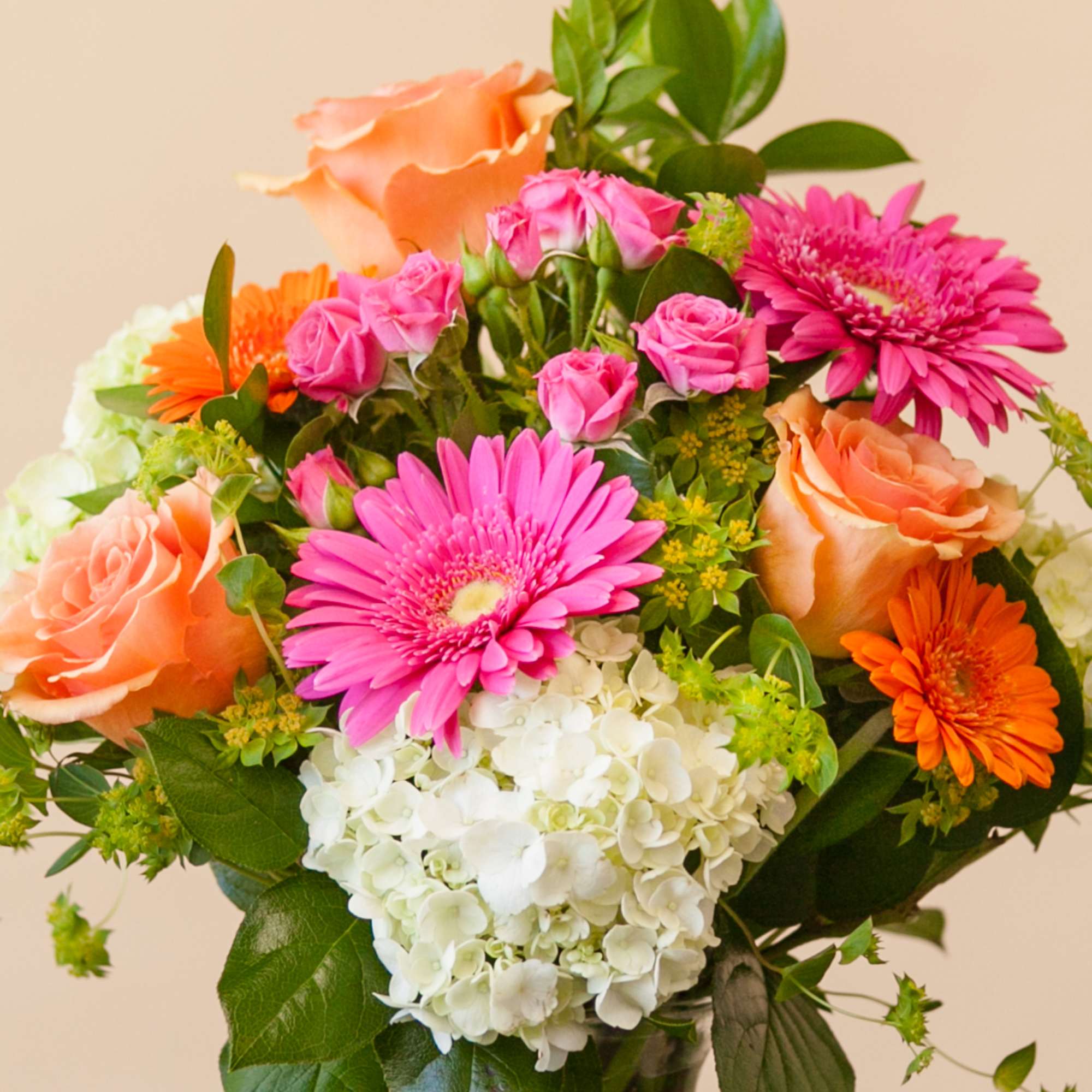 Bouquet of pink and peach flowers with white hydrangea