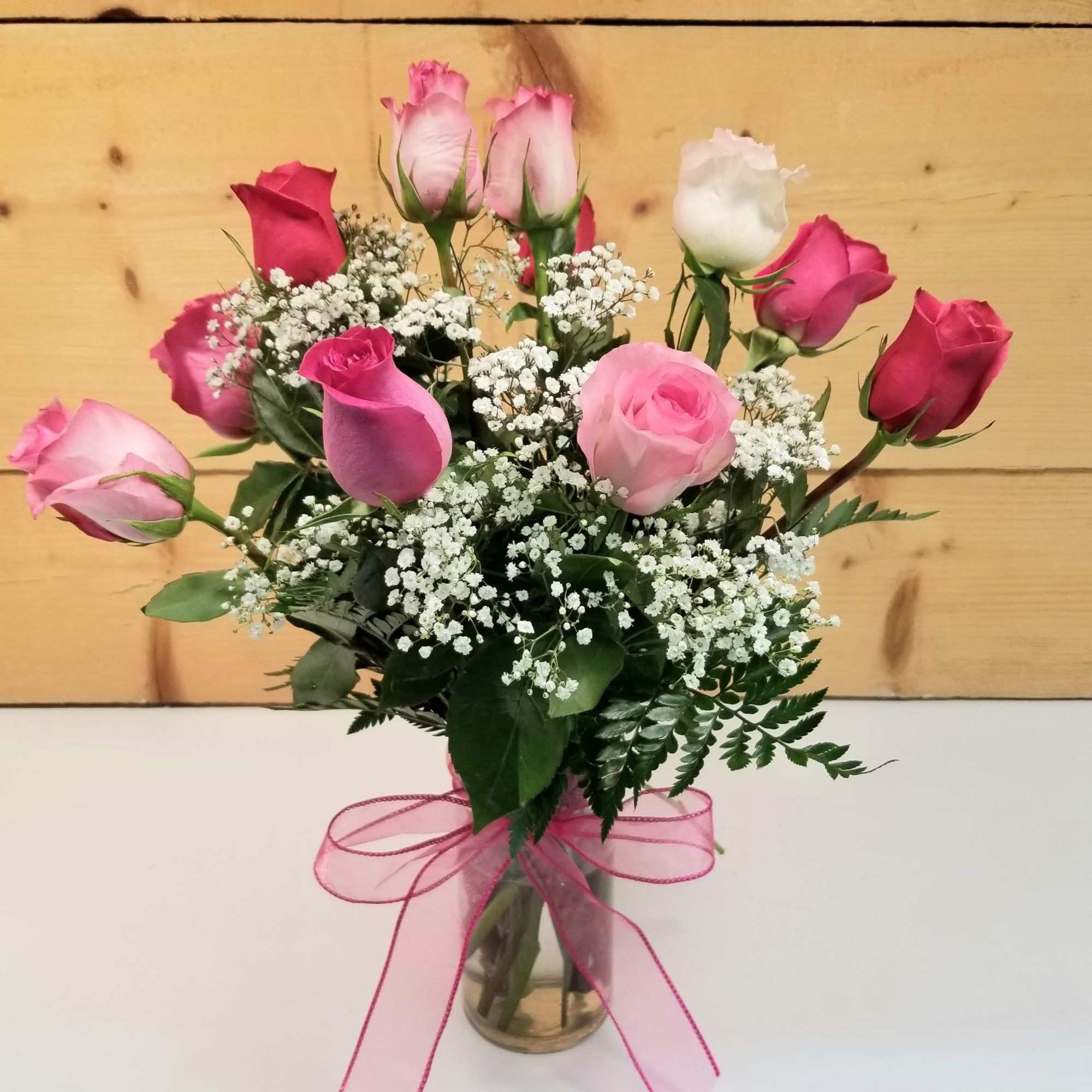 Our exquisite bouquet of magnificent, long-stem assorted roses, hand-crafted by our expert