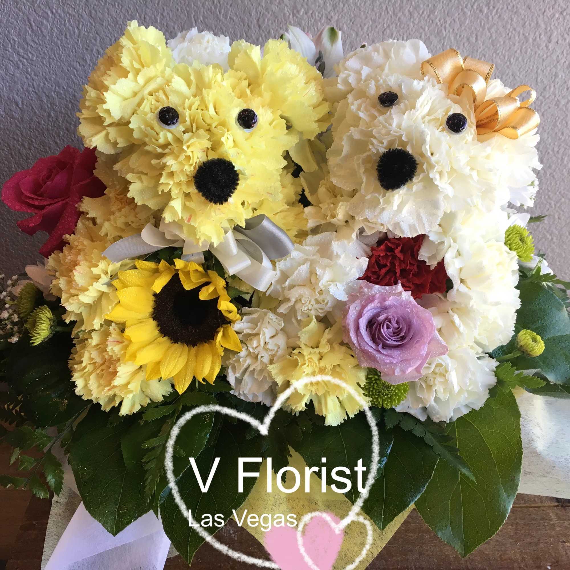 Two teddy bear floral arrangements with roses and carnations