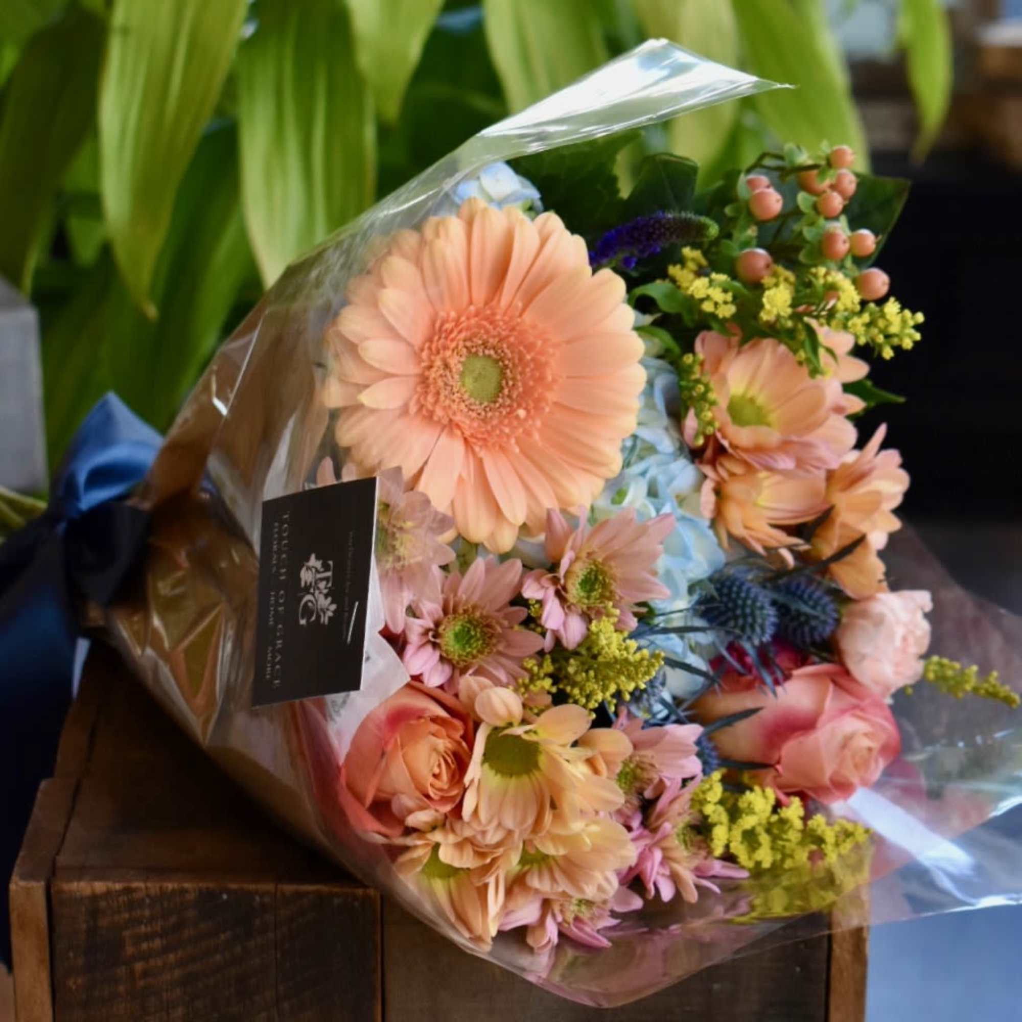 A hand-tied bouquet featuring the freshest flowers available in our shop. Each
