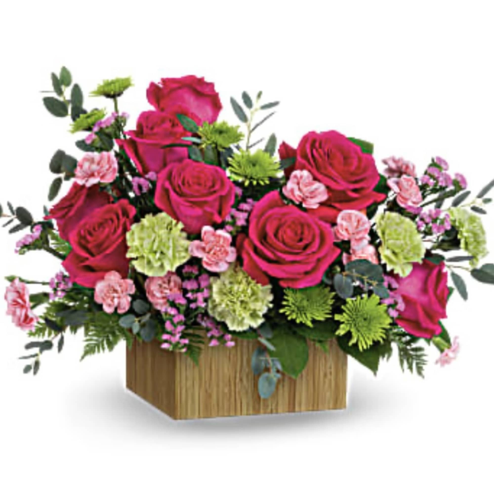 Pink roses and carnations in a wooden box