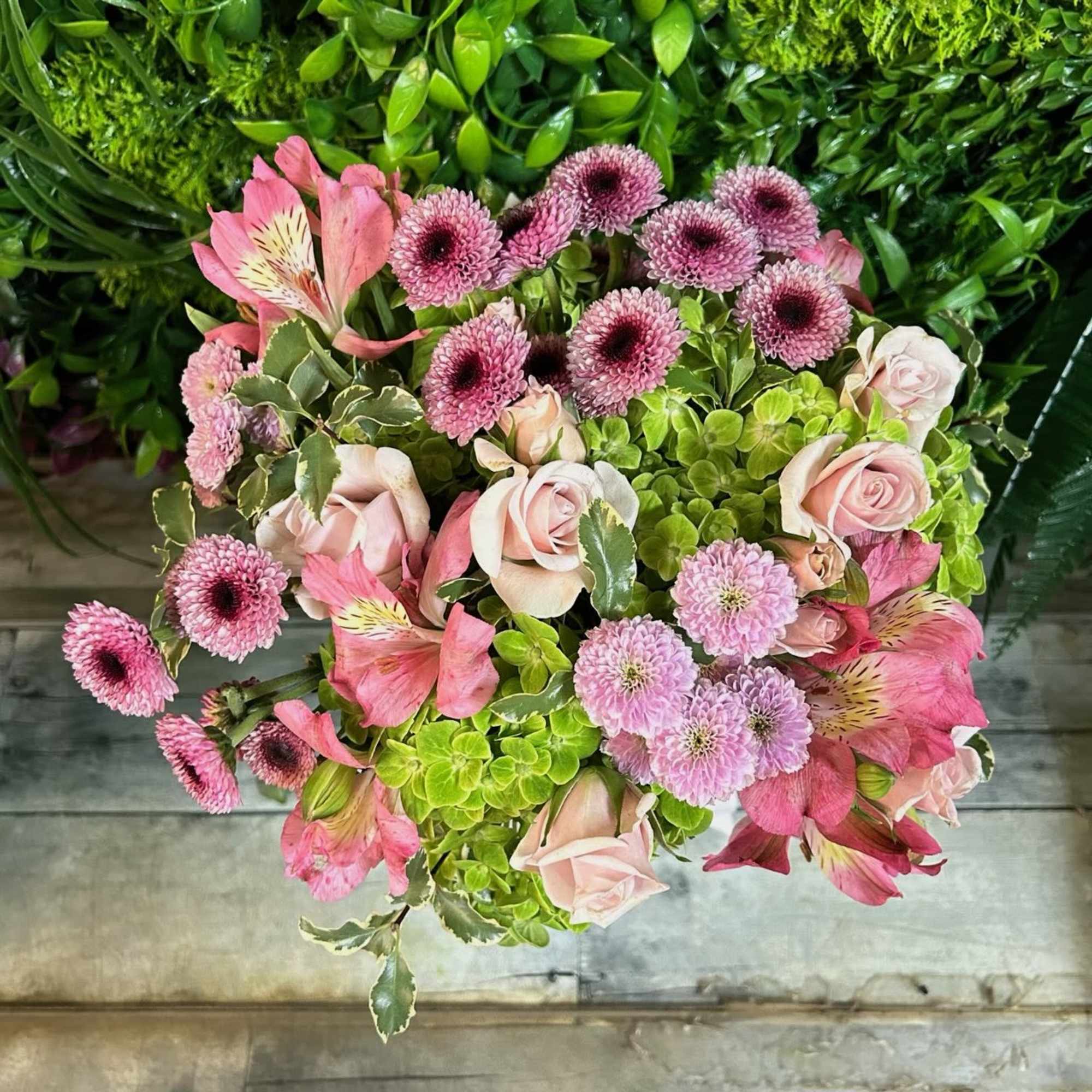 Pink and lavender bouquet with roses, alstroemeria, and pompon mums