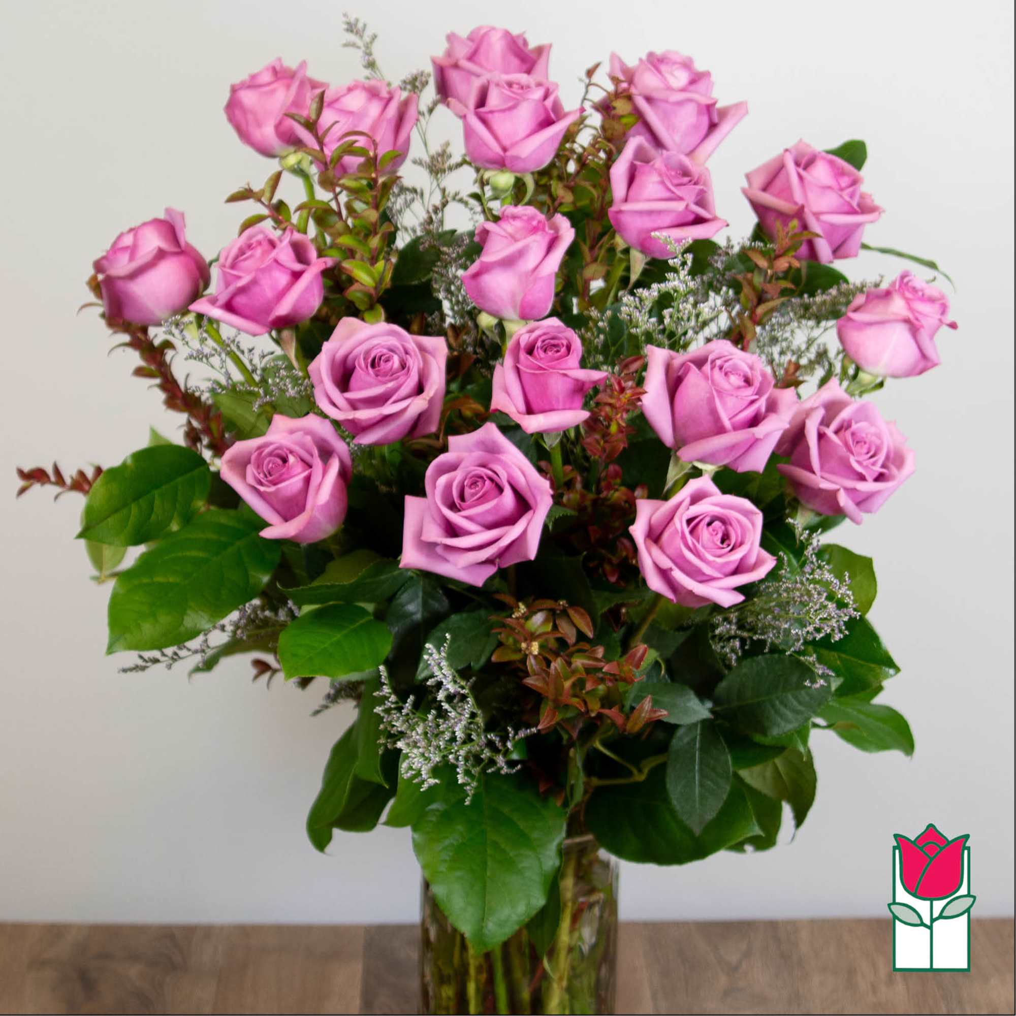 Bouquet of pink roses in a clear glass vase