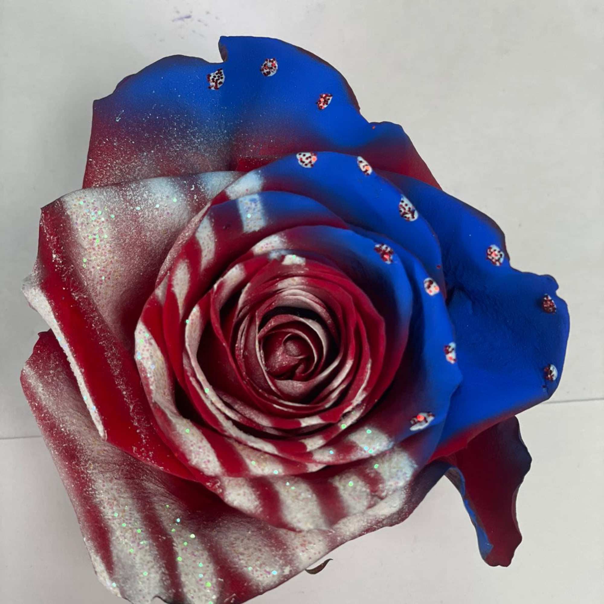 Celebrate with a stunning patriotic rose bouquet from Floral Concepts. Featuring red