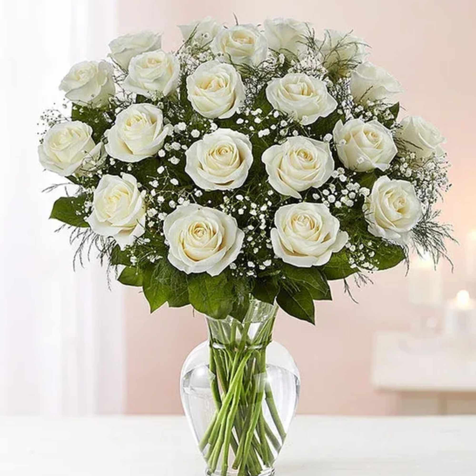 White rose bouquet in a clear glass vase