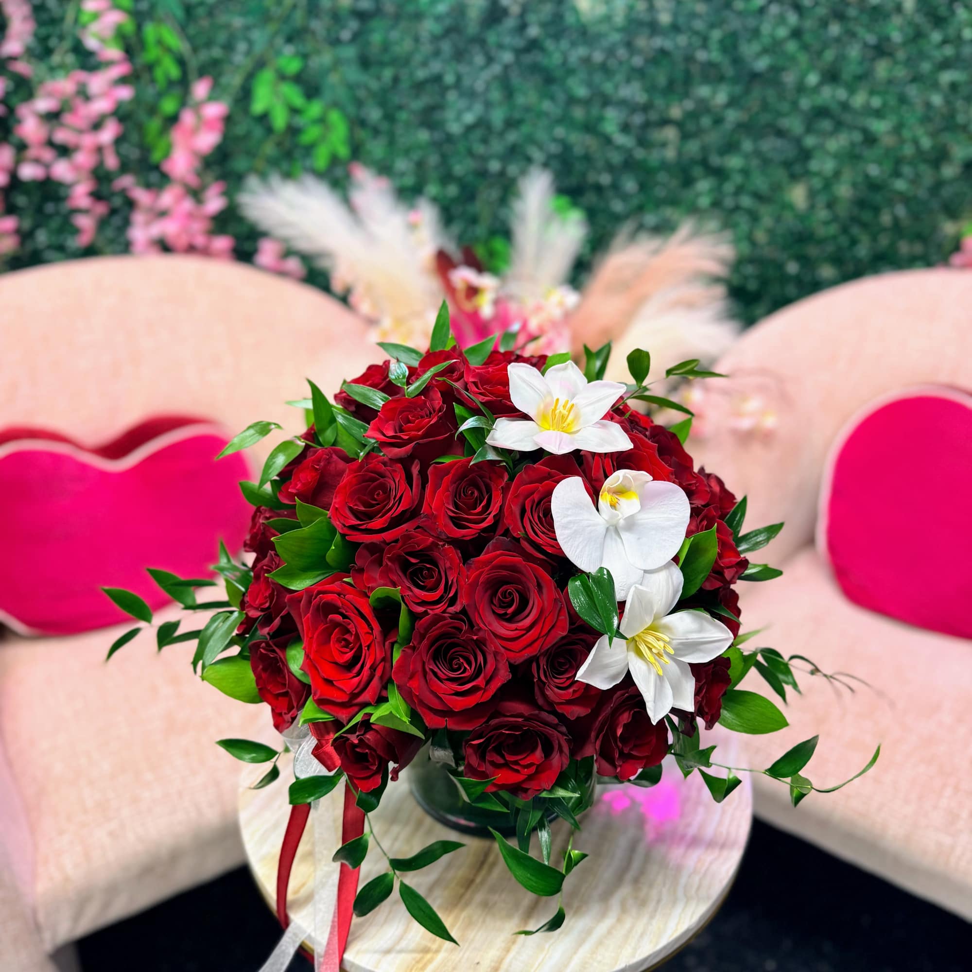 An ultra-luxury floral creation featuring an abundant number of premium red roses