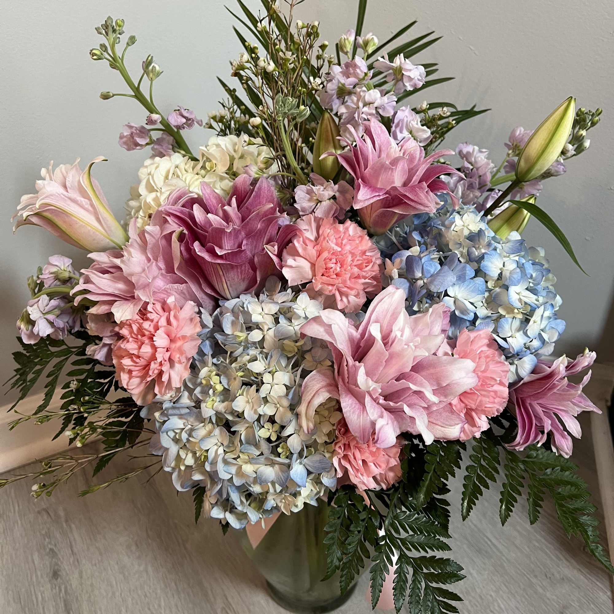 Indulge in the beauty of our meticulously crafted floral arrangement, featuring a