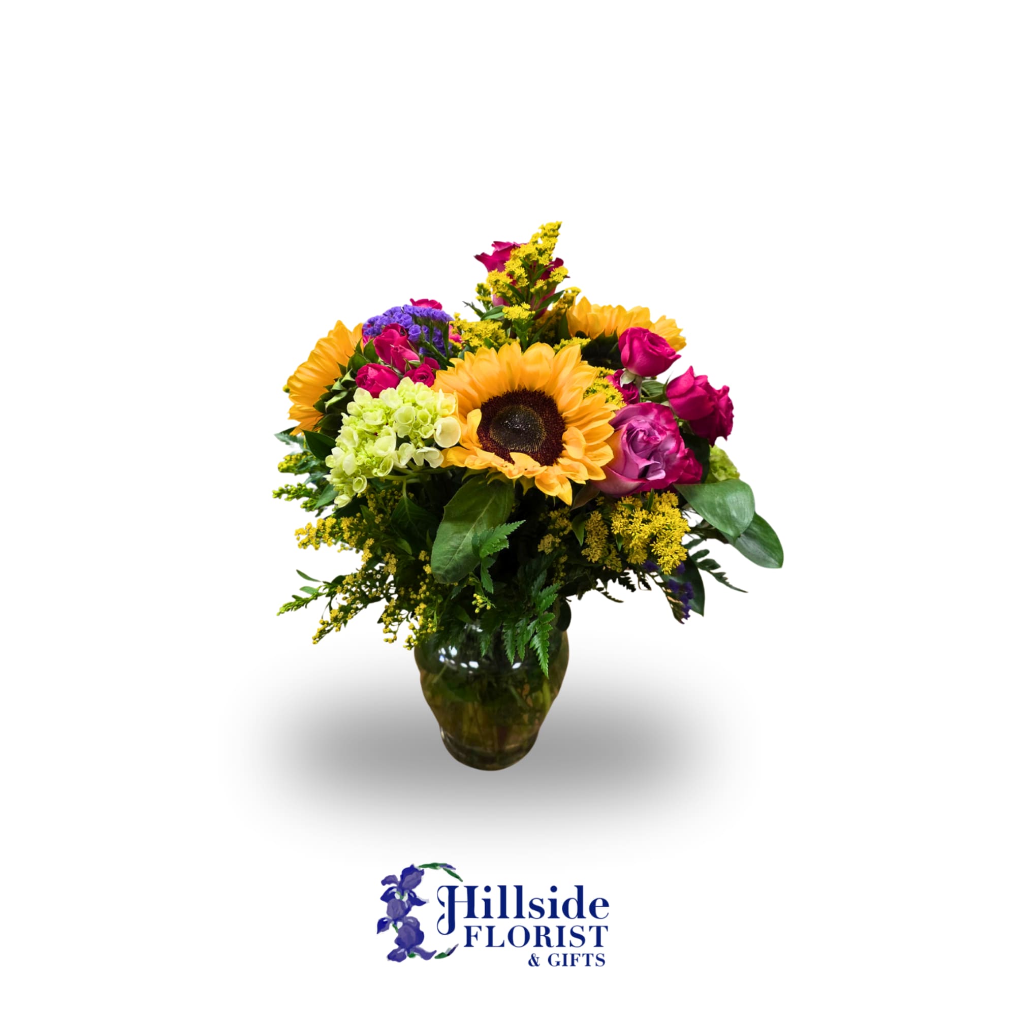 Mixed bouquet with a sunflower and pink roses in a glass vase