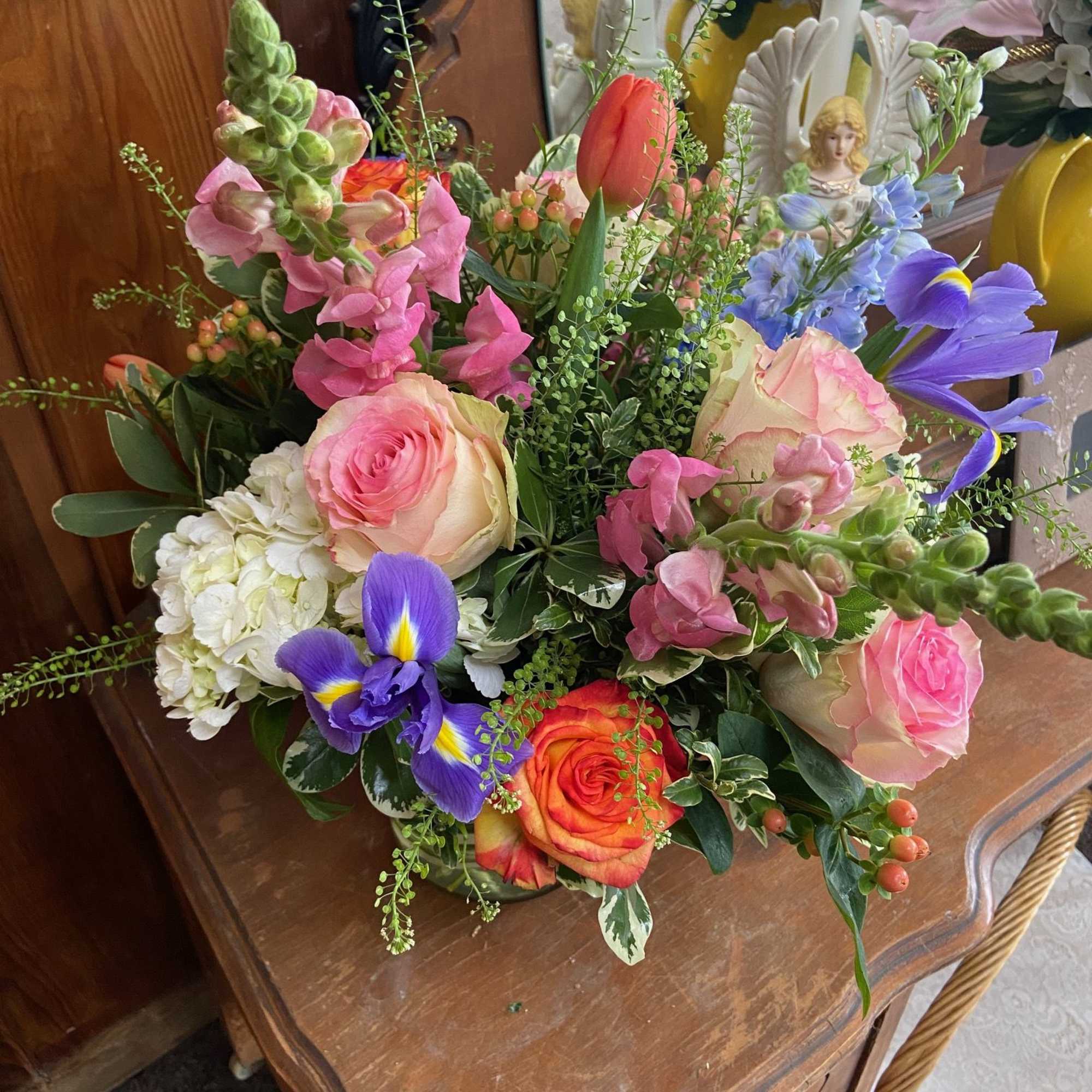 Mix of bright but feminine Spring flowers in 5 x 5 cylinder.