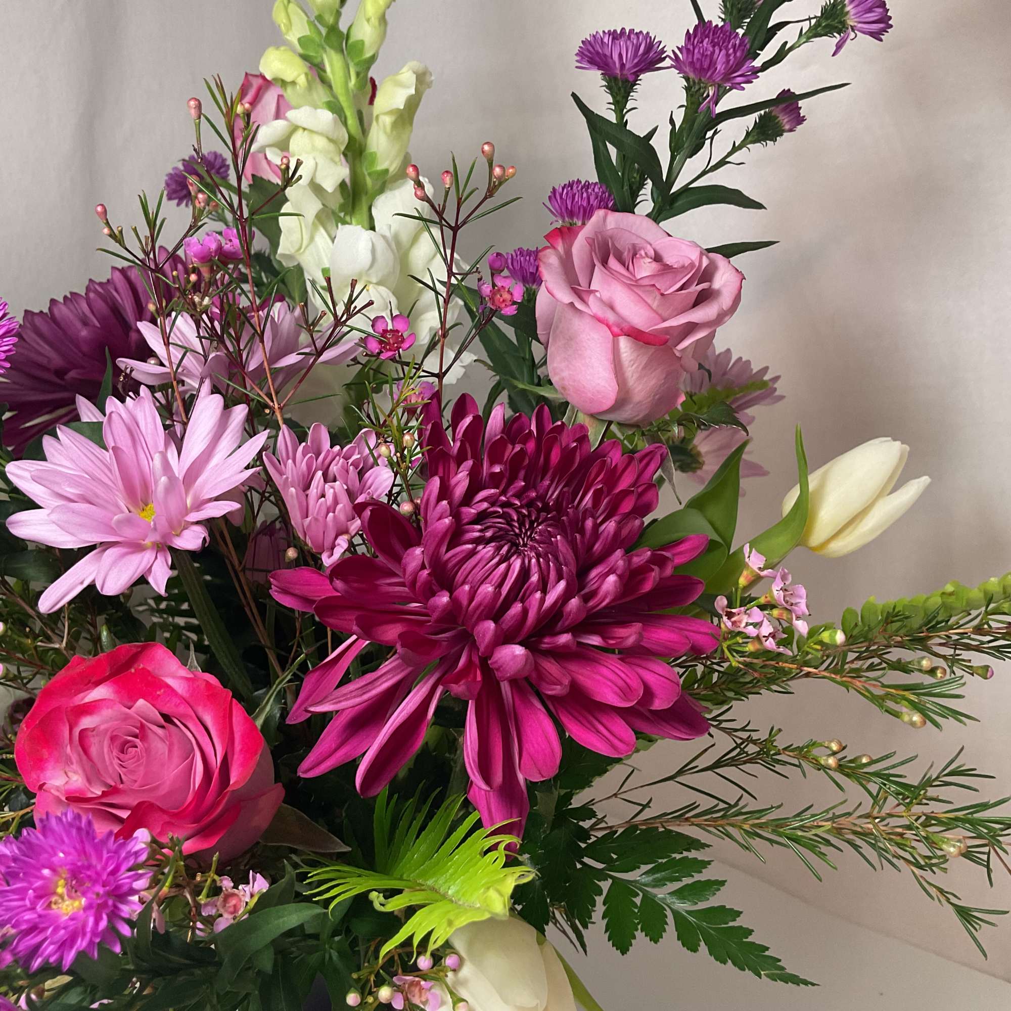 A captivating blend of lavender, purple, and white flowers, elegantly presented in