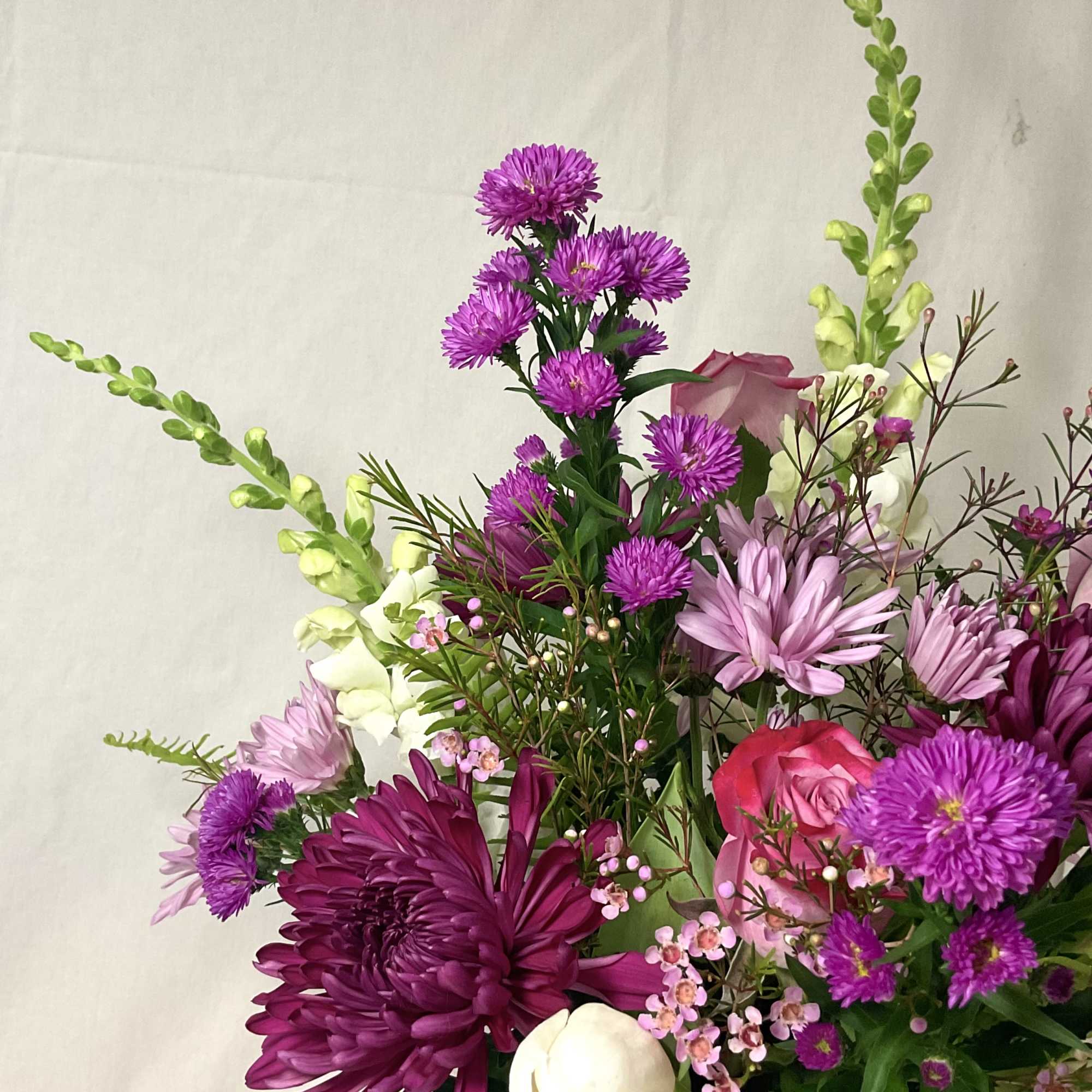 A captivating blend of lavender, purple, and white flowers, elegantly presented in