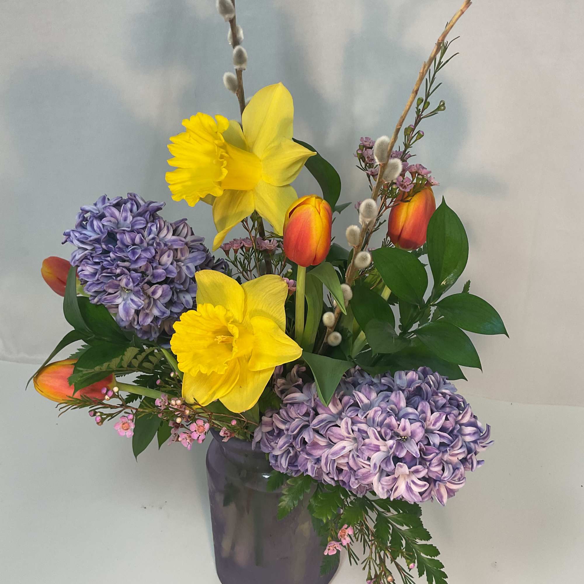 A gorgeous arrangement of fresh and bright seasonal flowers.
