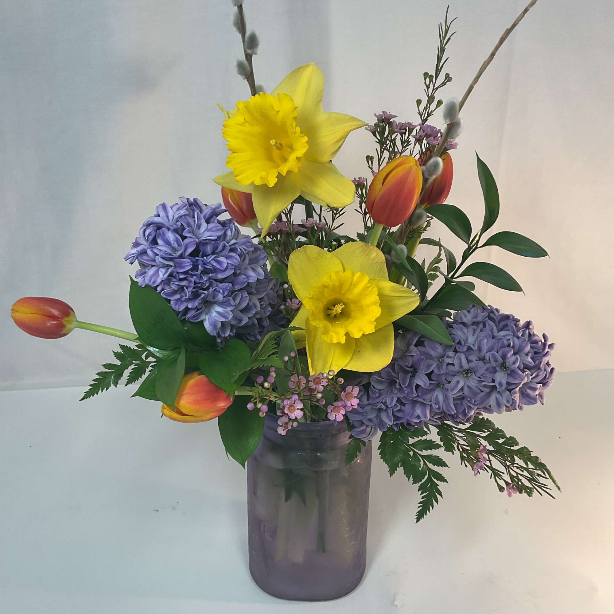 A gorgeous arrangement of fresh and bright seasonal flowers.