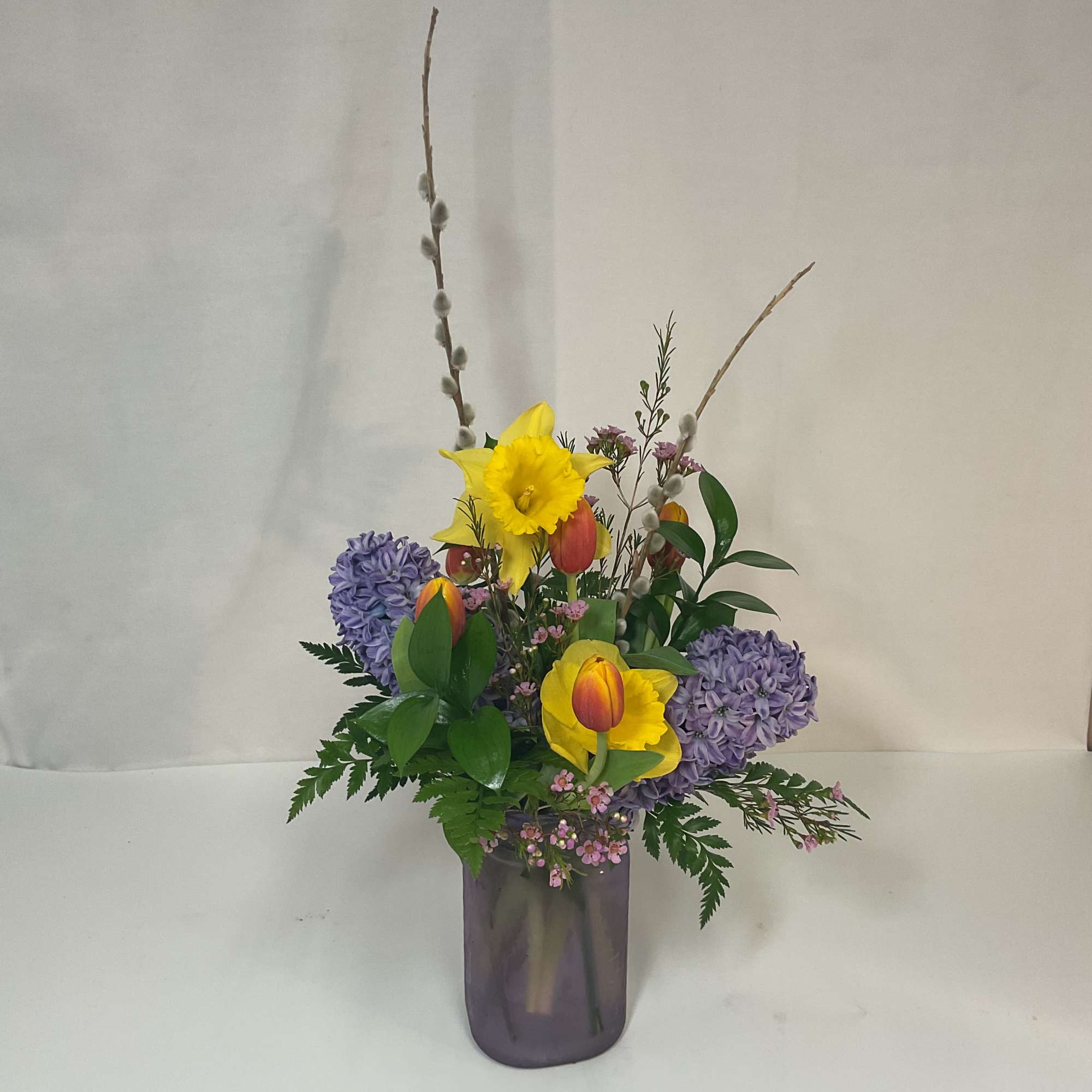 A gorgeous arrangement of fresh and bright seasonal flowers.