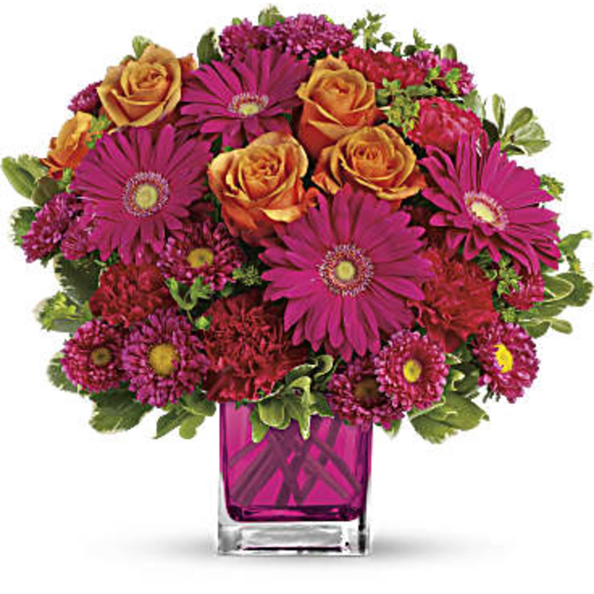 Pink and orange mixed bouquet in a square glass vase