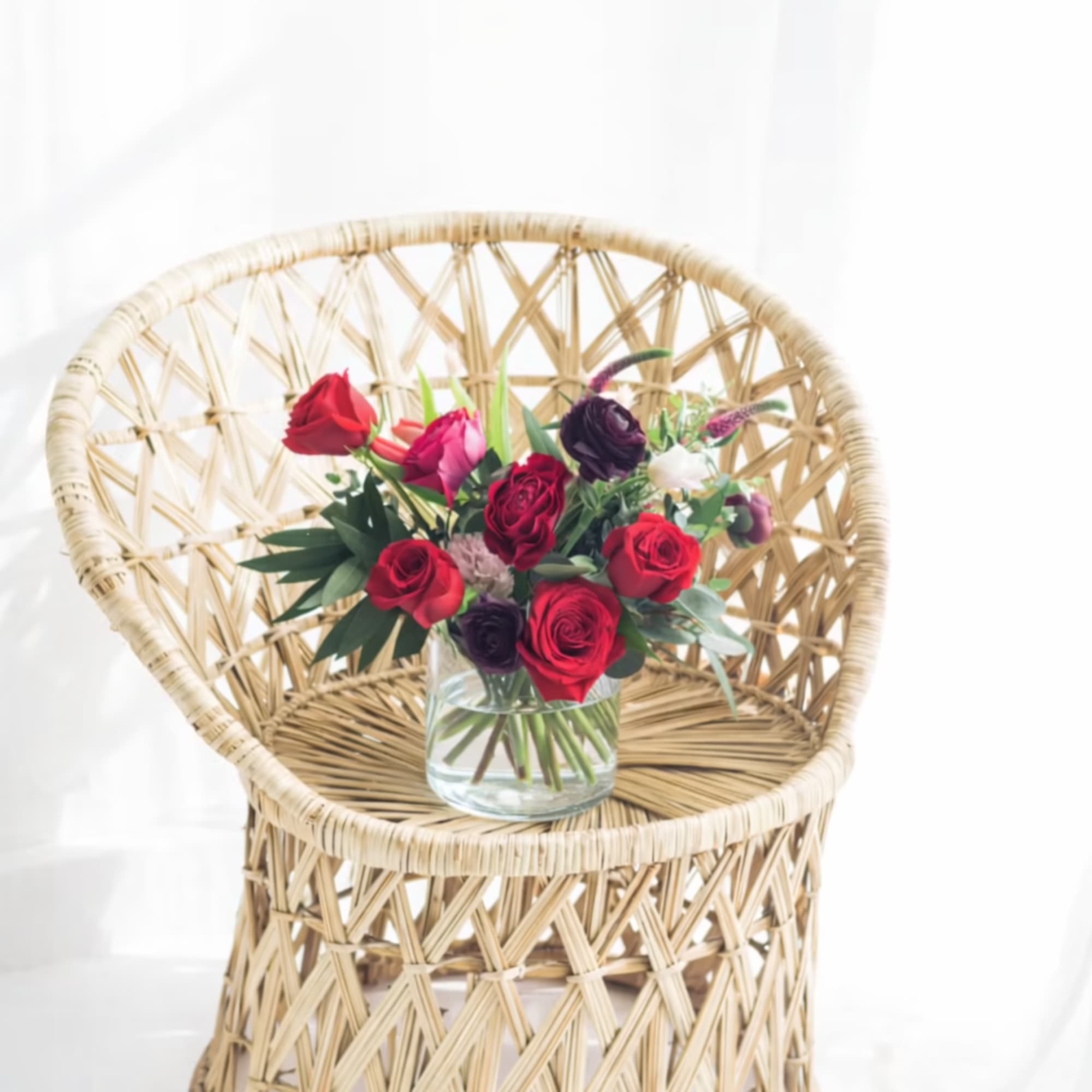 A signature Aquarela arrangement featuring premium seasonal blooms and fresh greens, designed