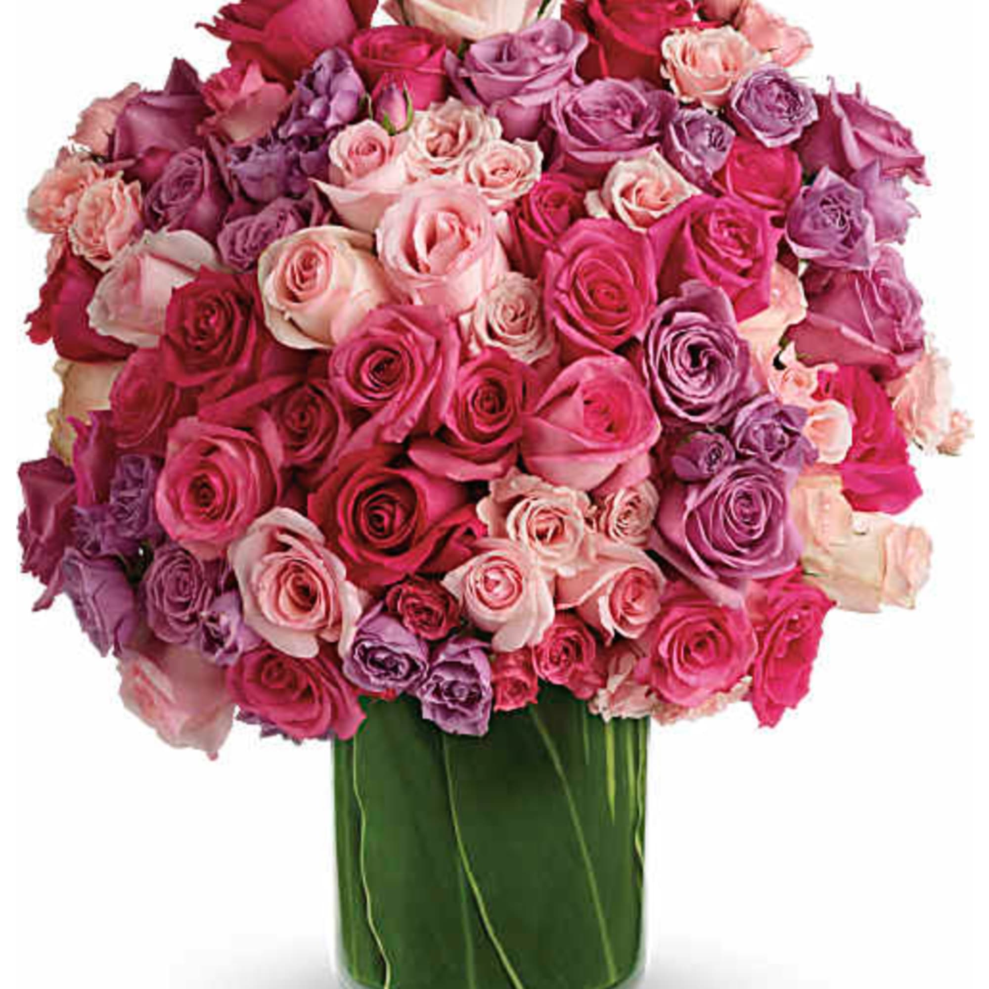 A lush dome of roses in pink, lavender, peach and white greets