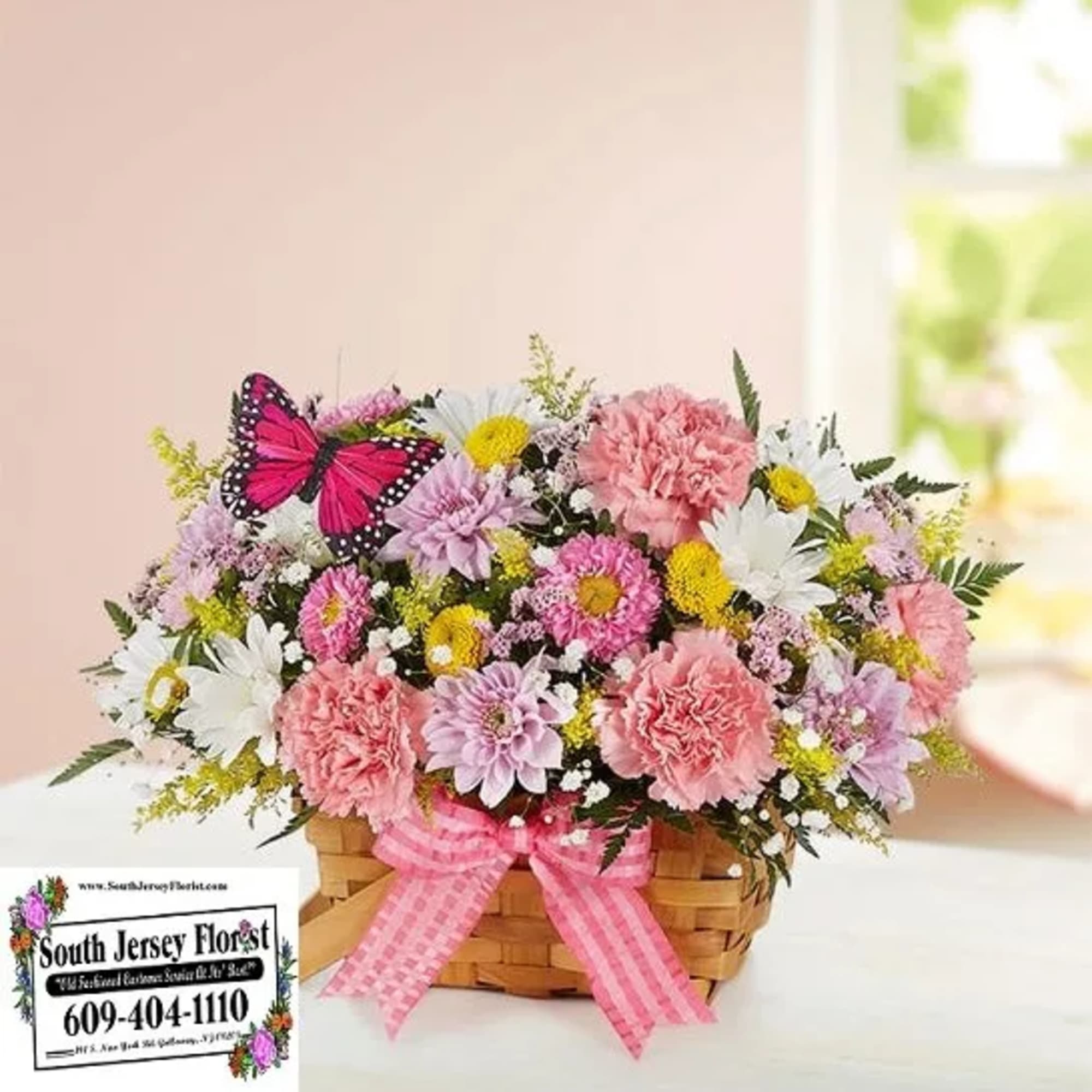 Our charming basket of blooms is an easy, go-to gift for any