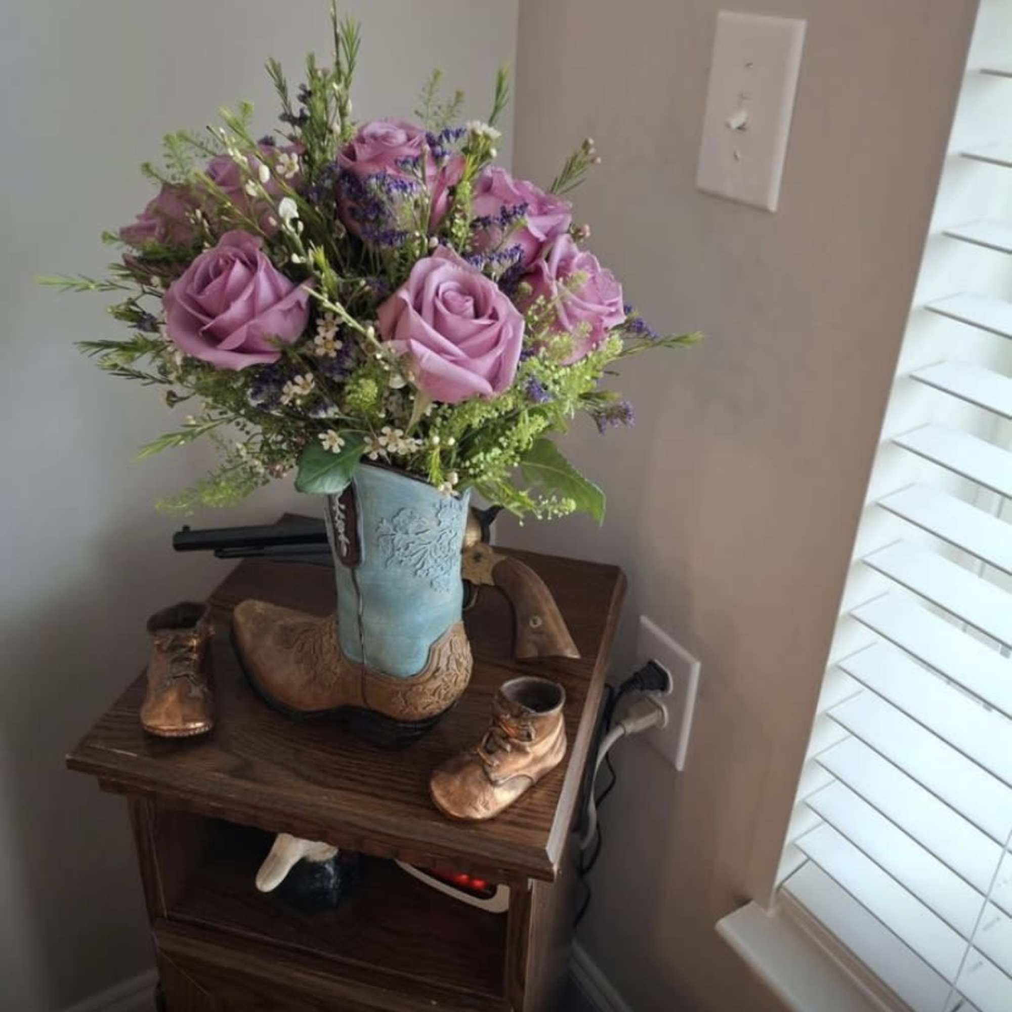 Lavender rose bouquet in a cowboy boot vase