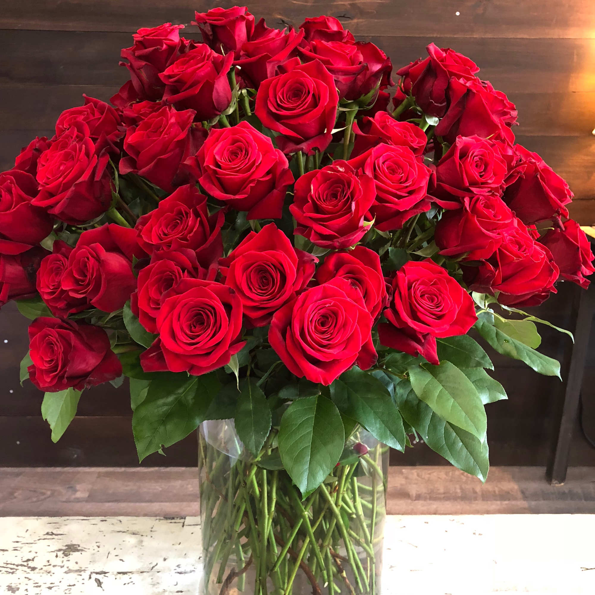 Bouquet of red roses in a clear glass vase