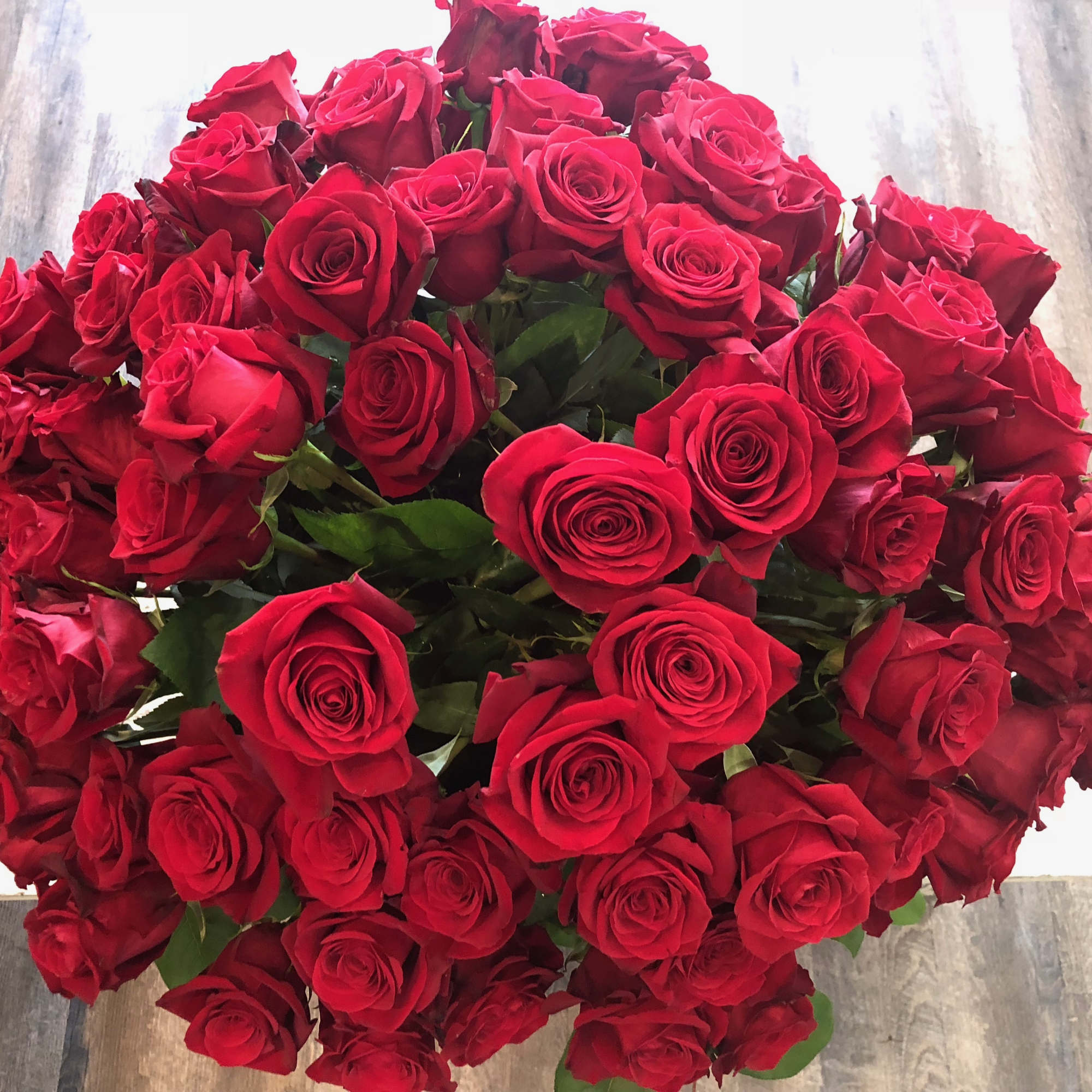 Large bouquet of red roses on a table