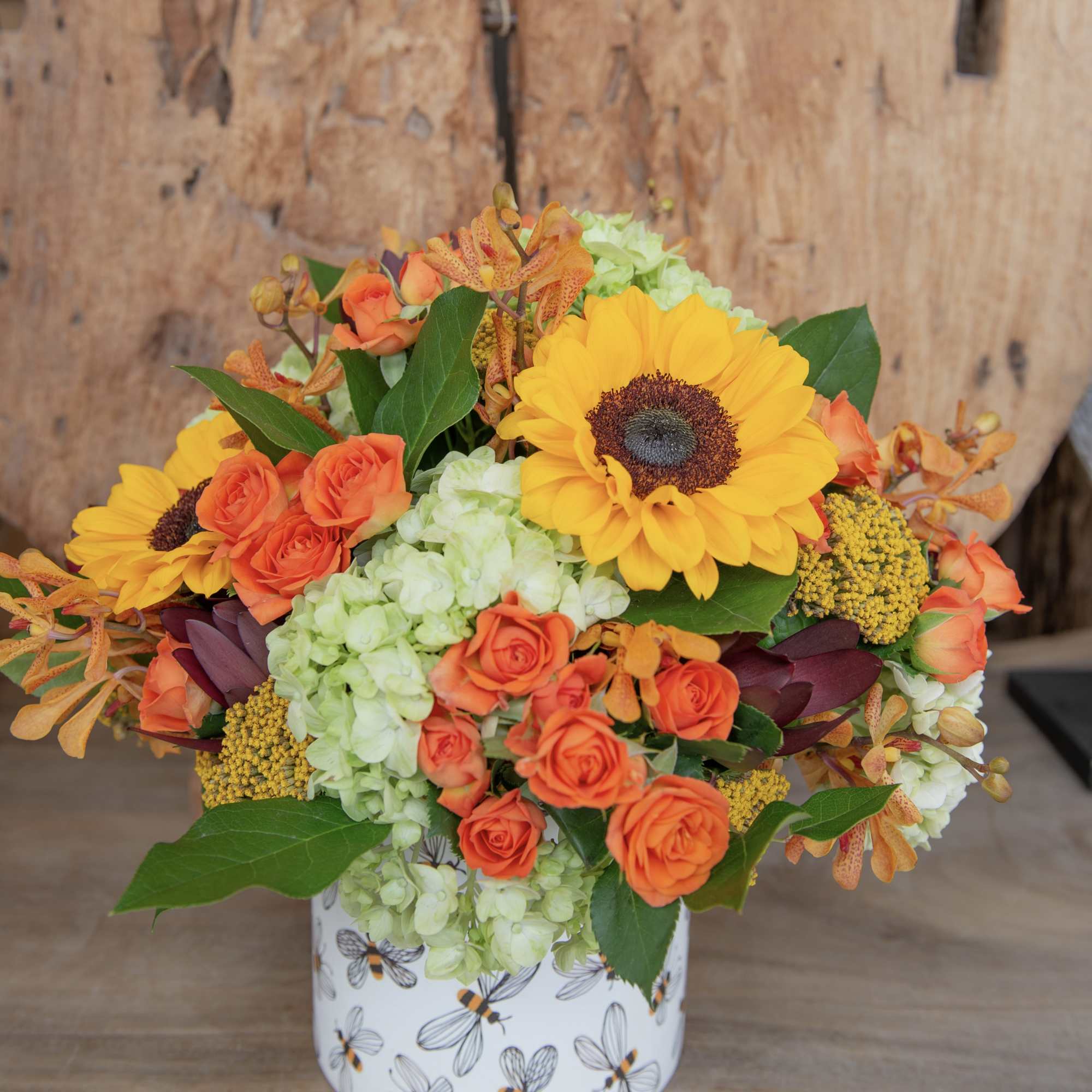 Say hello to autumn with our honey bee ceramic vase filled with