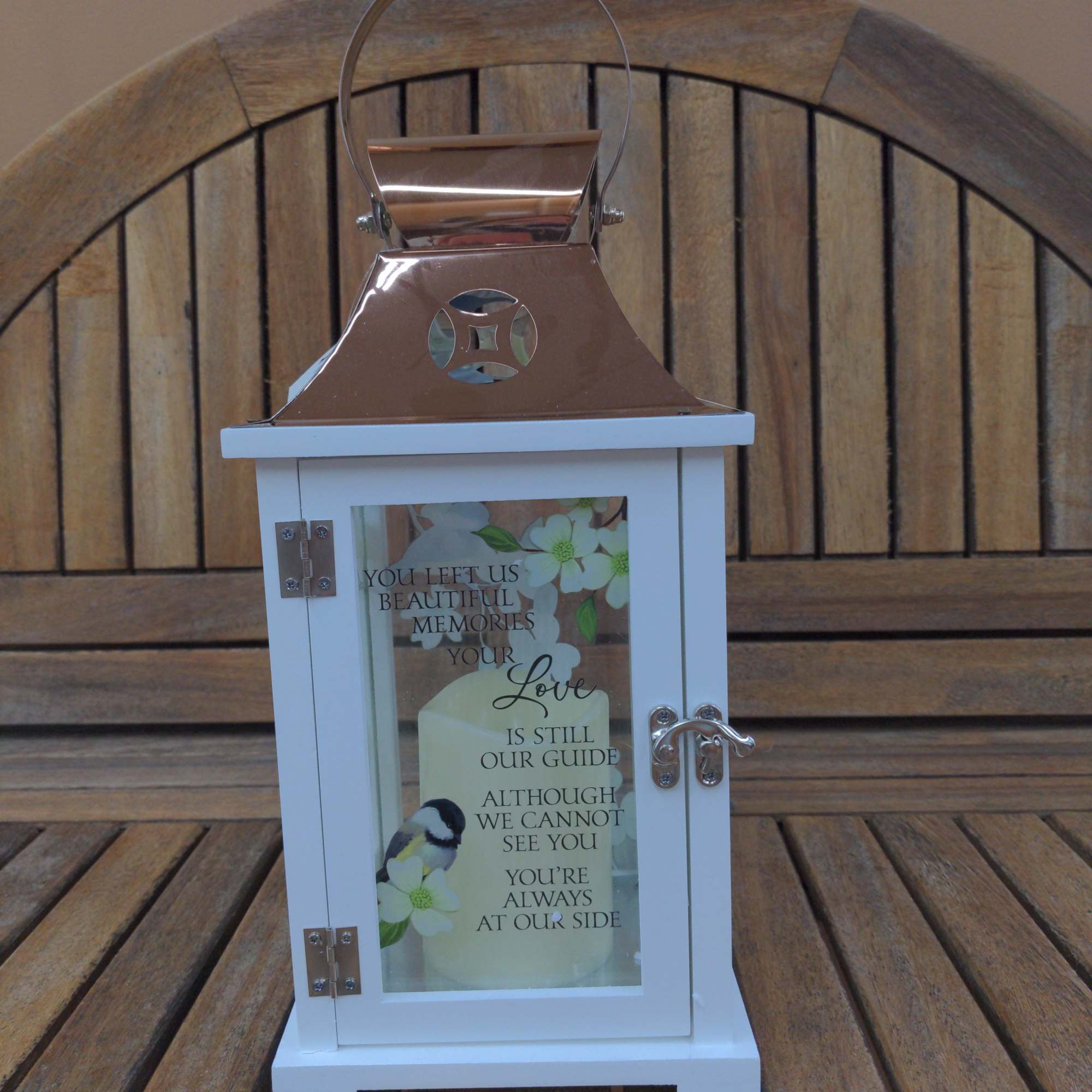 White memorial lantern with a printed sympathy message and floral design