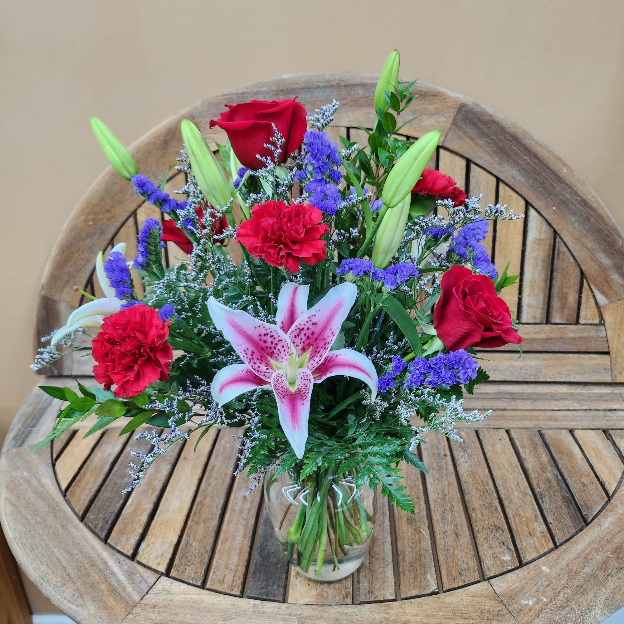 Vase Arrangement Mixed seasonal Flowers
Lily color may vary