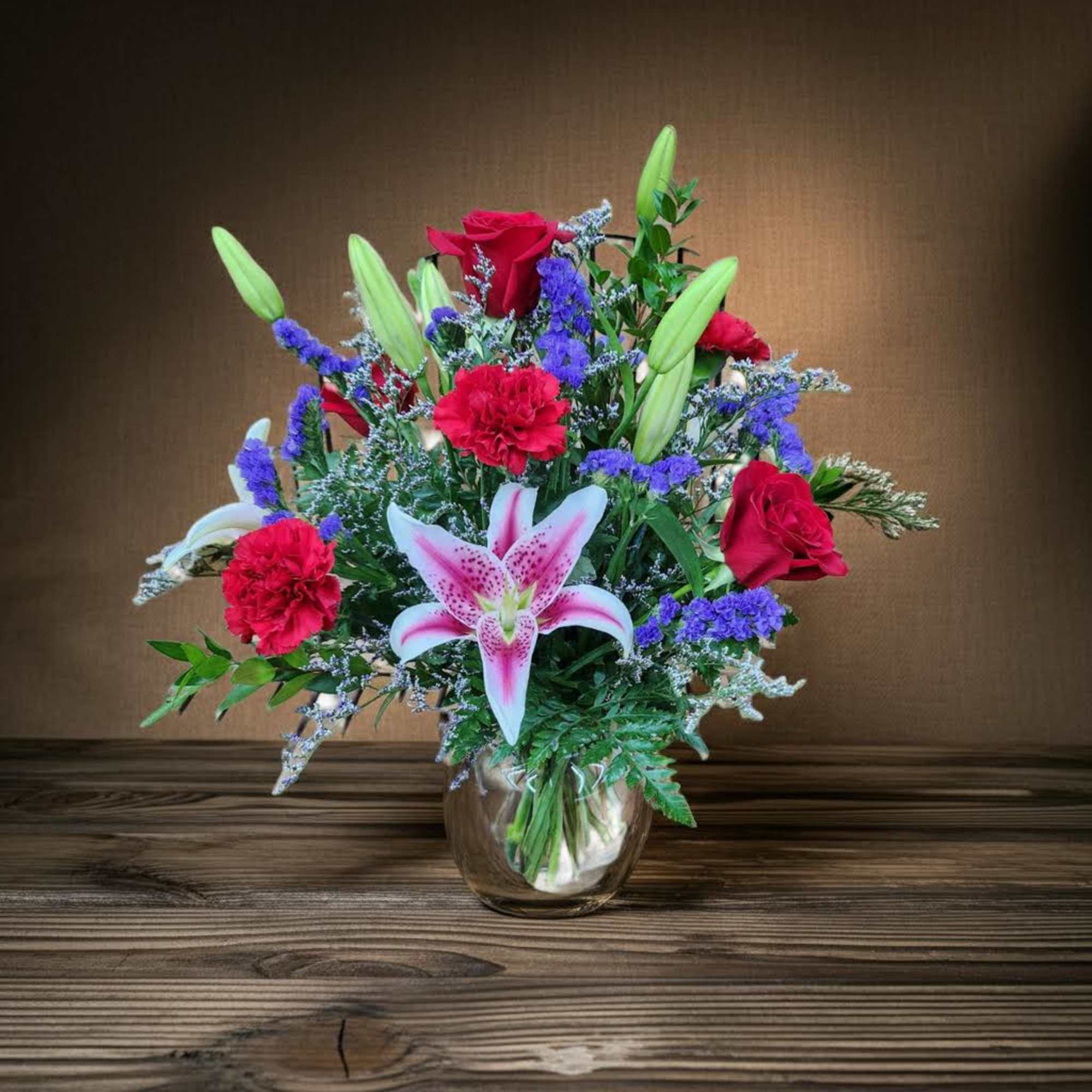 Vase Arrangement Mixed seasonal Flowers
Lily color may vary
