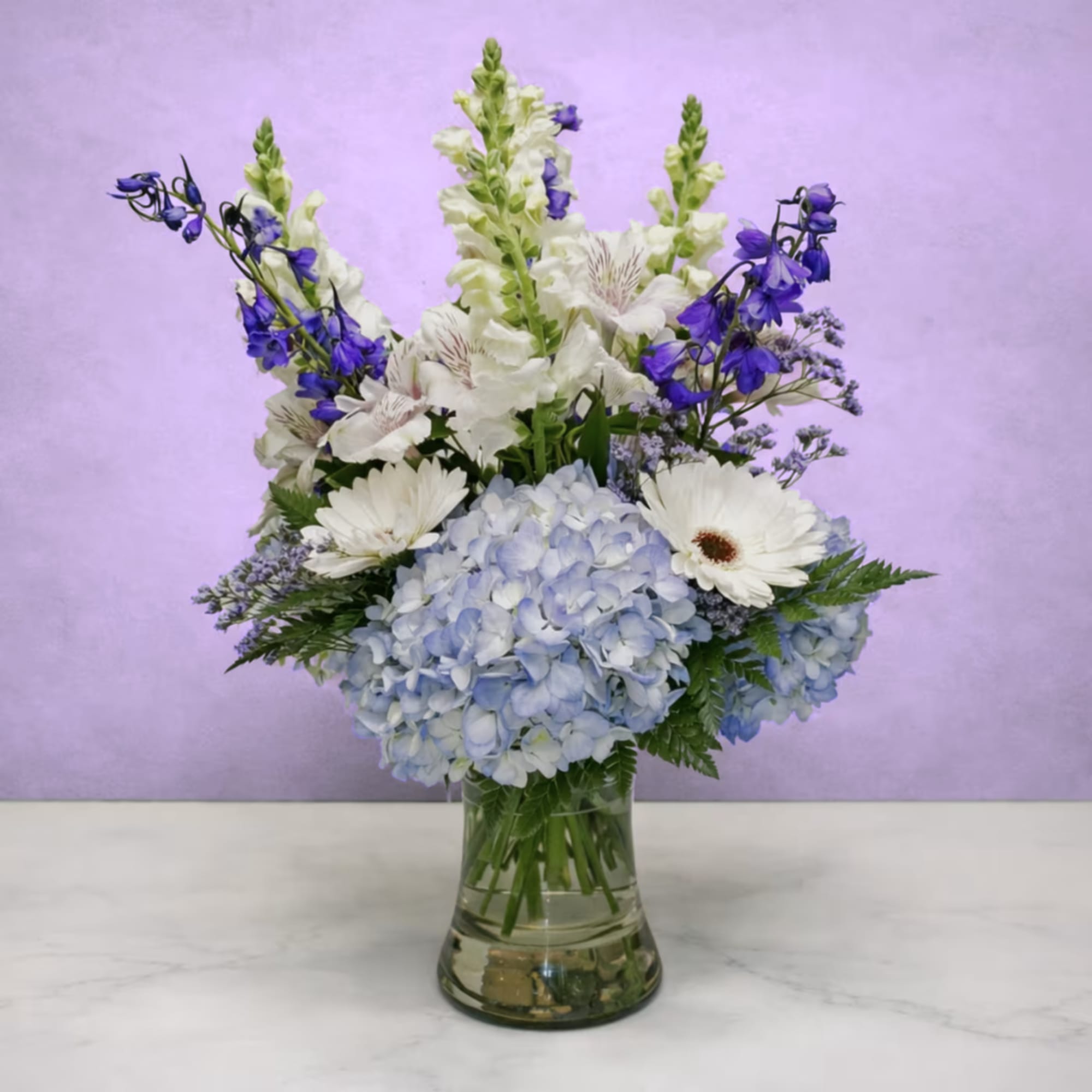 Whispering Winds Bouquet by Savilles Country Florist is a stunning display featuring
