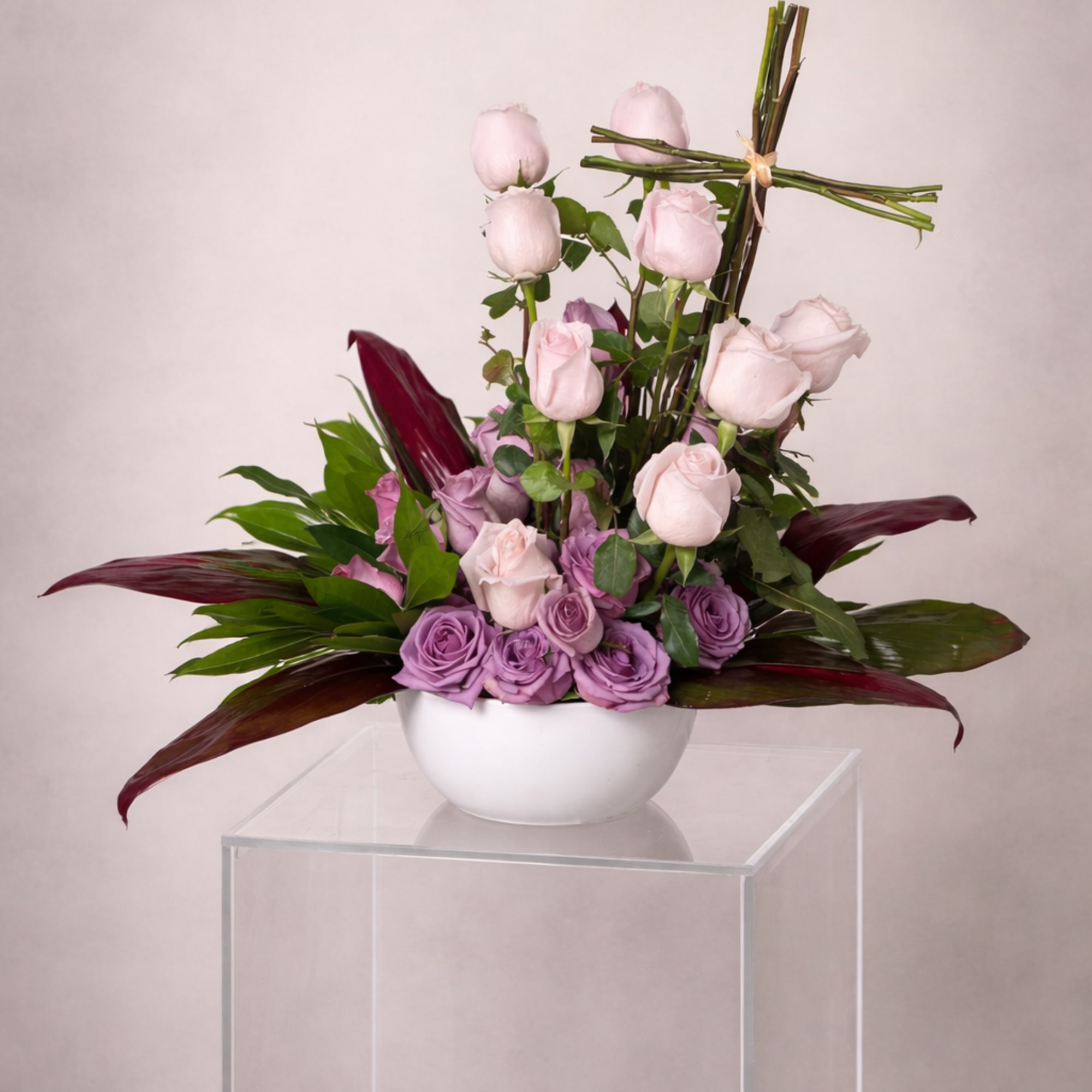 A deeply heartfelt sympathy tribute featuring lush, velvety roses and rich exotic