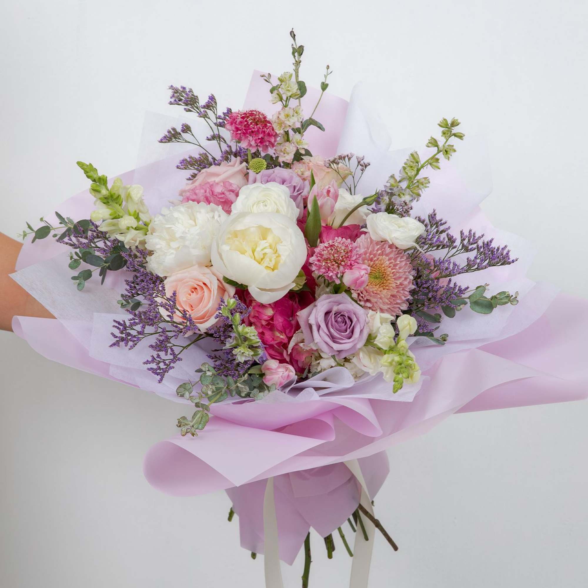 A soft, romantic garden bouquet made with premium seasonal blooms.
This is a