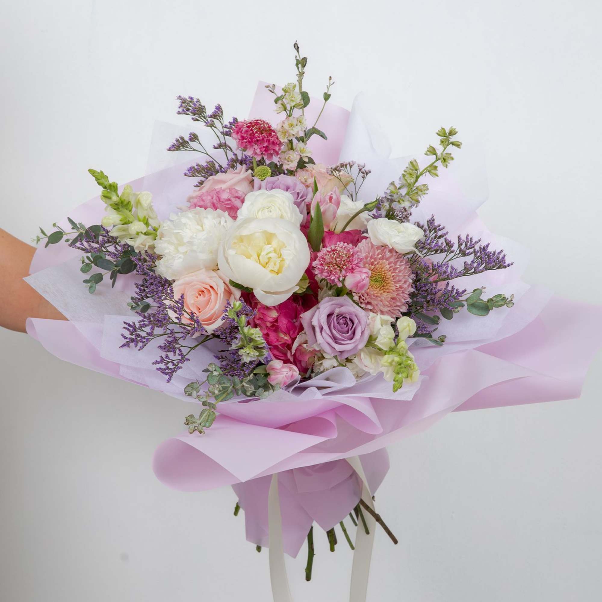 A soft, romantic garden bouquet made with premium seasonal blooms.
This is a