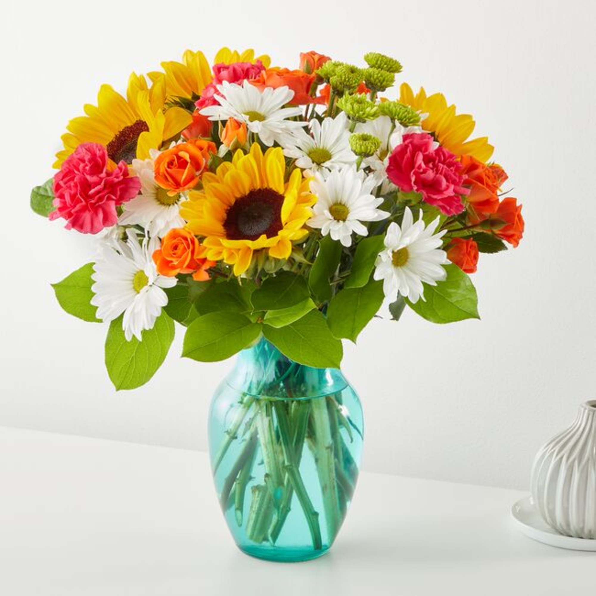 Welcome warmer weather with the Sun-Drenched Blooms Bouquet! Sunflowers, hot pink carnations