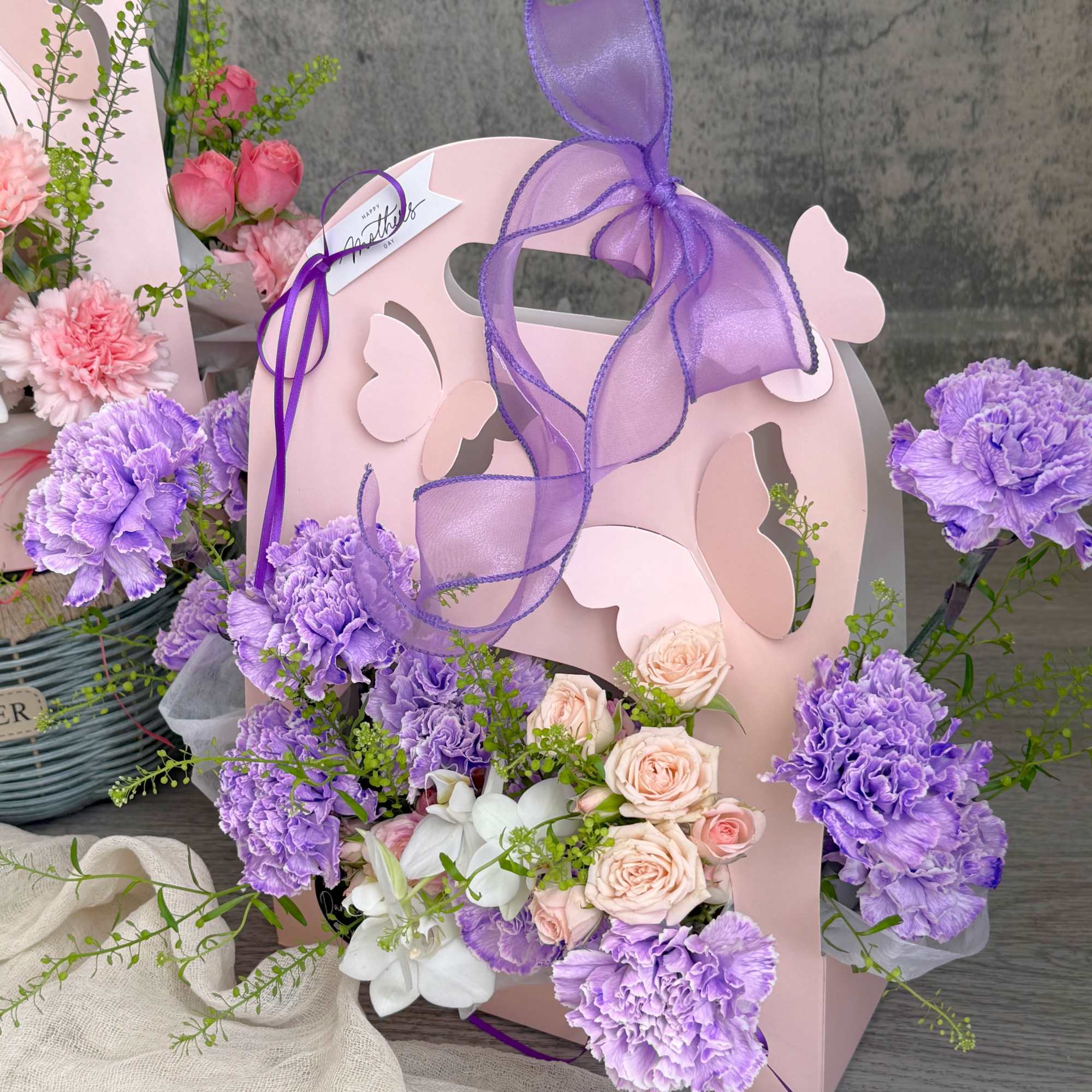 Delicate blooms in soft pastel tones, nestled in a charming butterfly pink