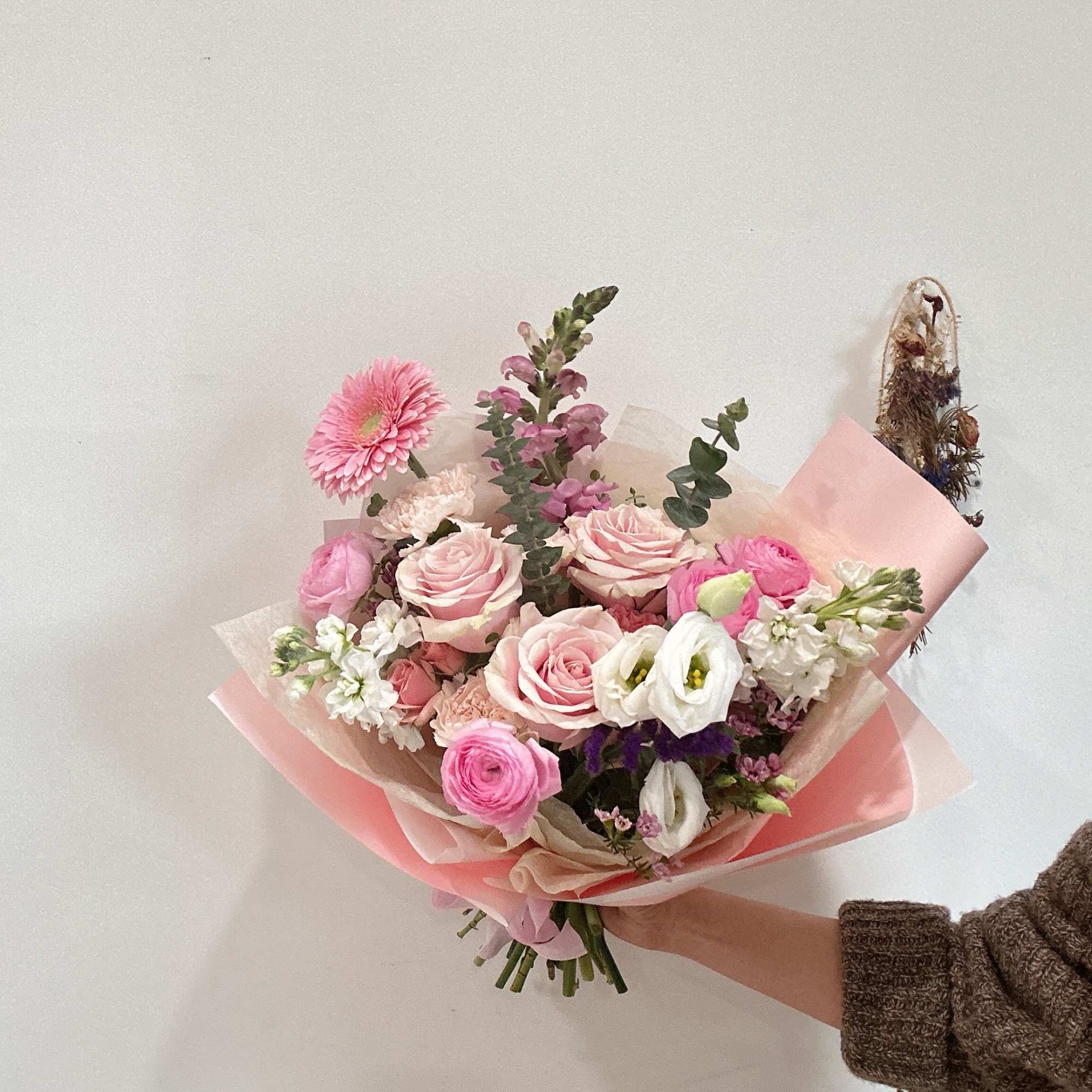 Pink and white mixed bouquet wrapped in blush paper