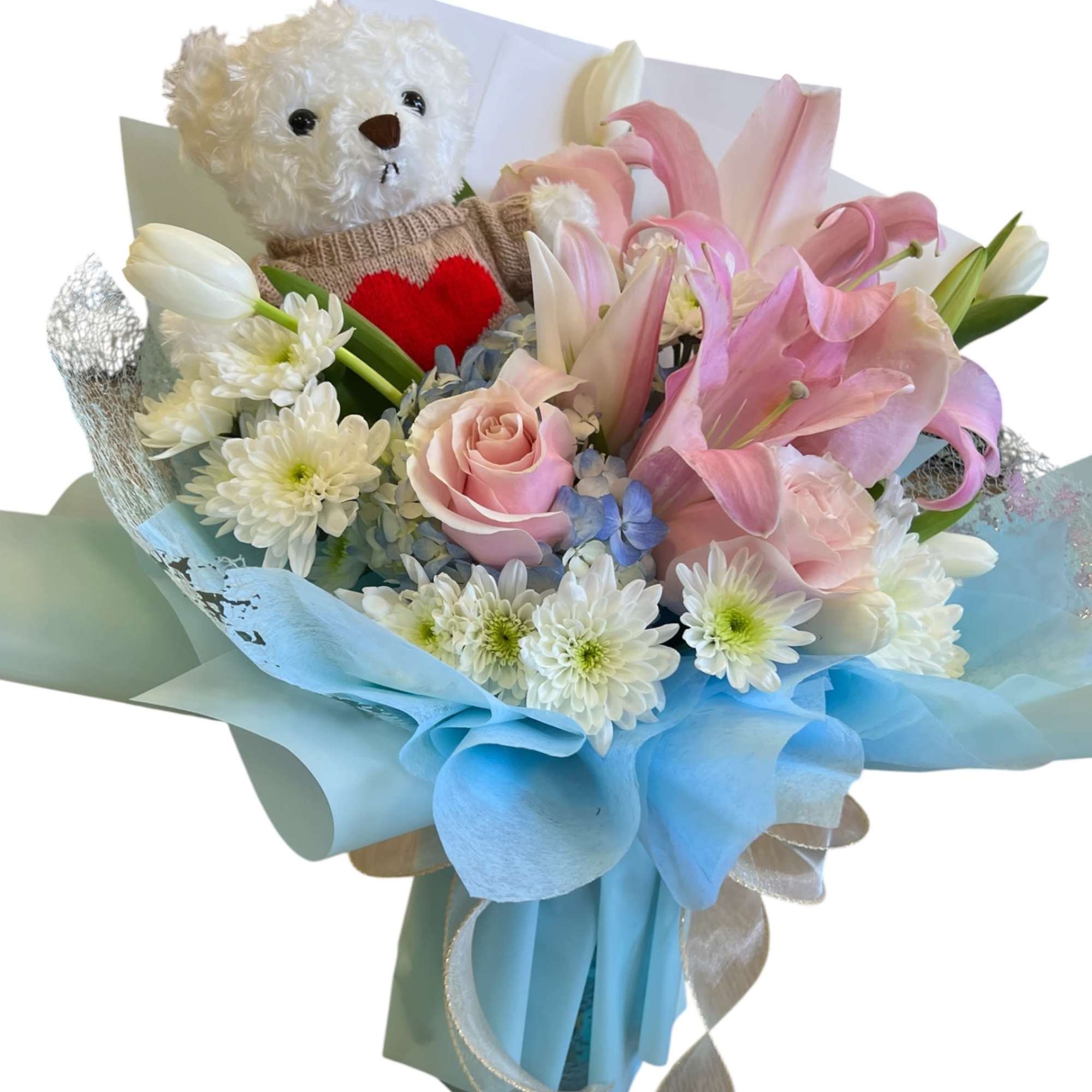 A charming bouquet featuring soft pink lilies, roses, and delicate white blooms