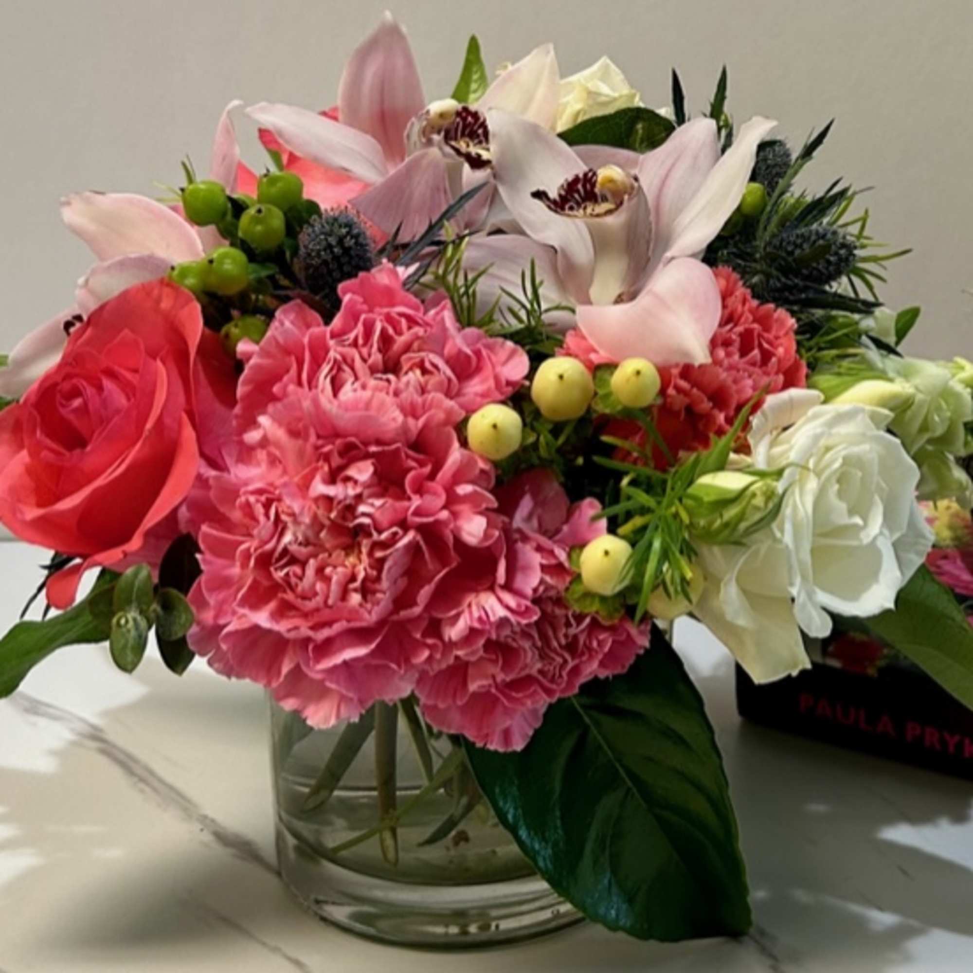 Pink and white mixed bouquet in a clear glass vase