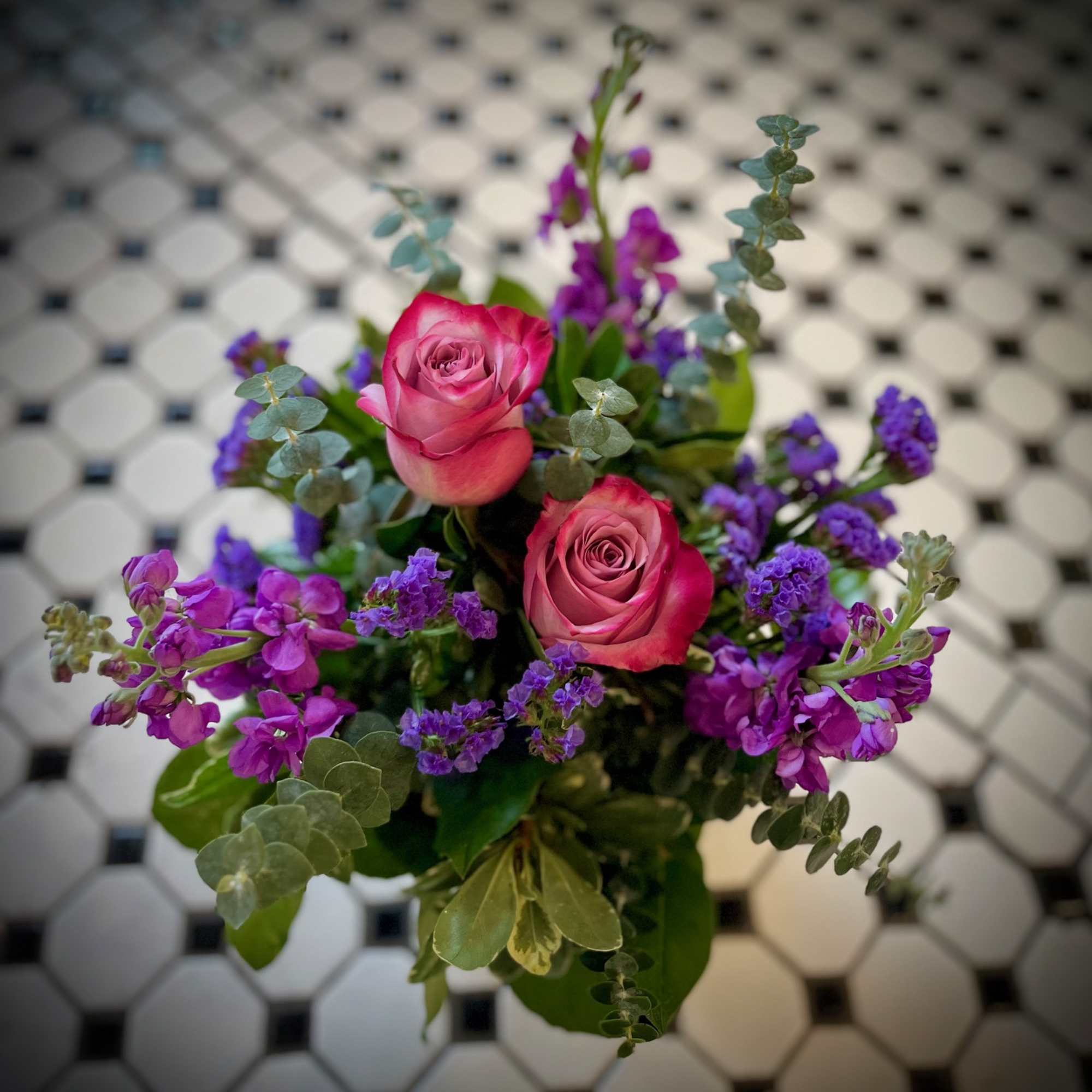 "Purple Passion" Is a beautiful monochromatic arrangement featuring two purple roses, purple