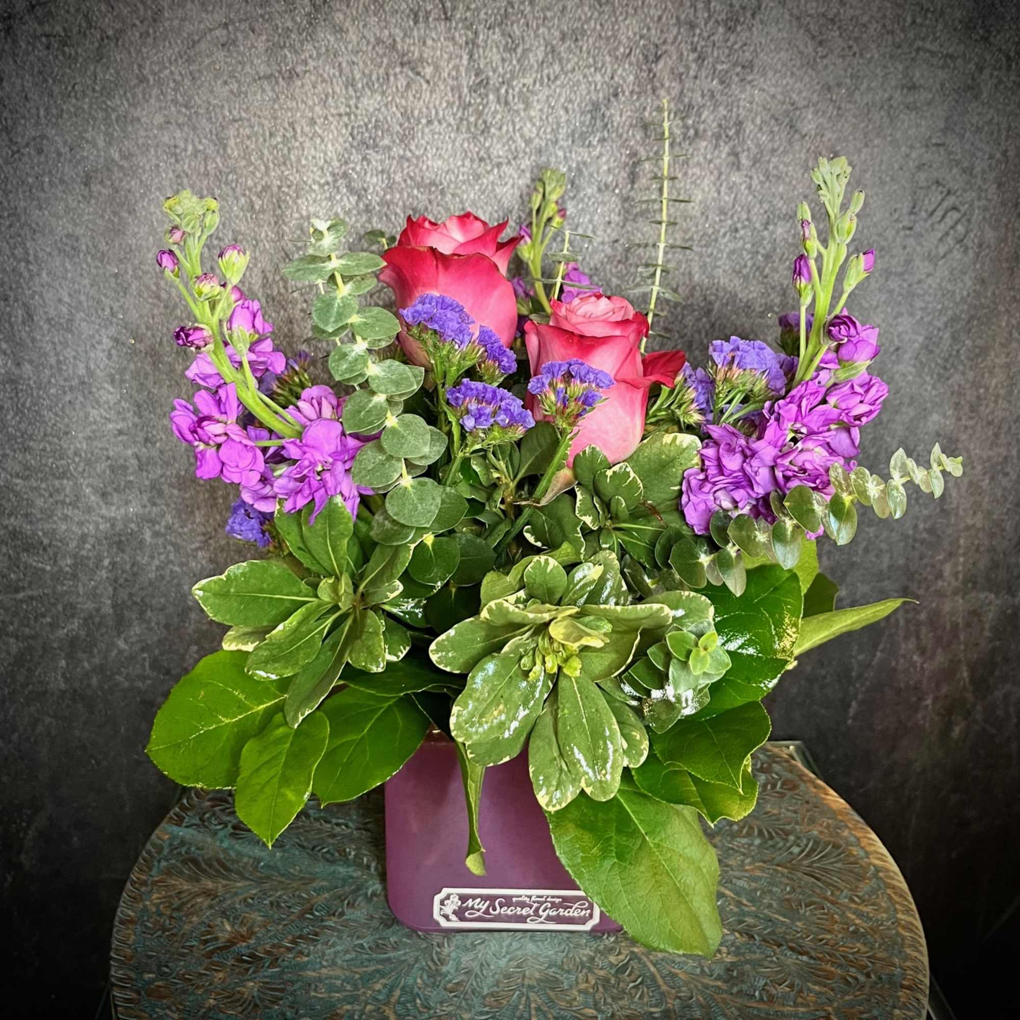 "Purple Passion" Is a beautiful monochromatic arrangement featuring two purple roses, purple