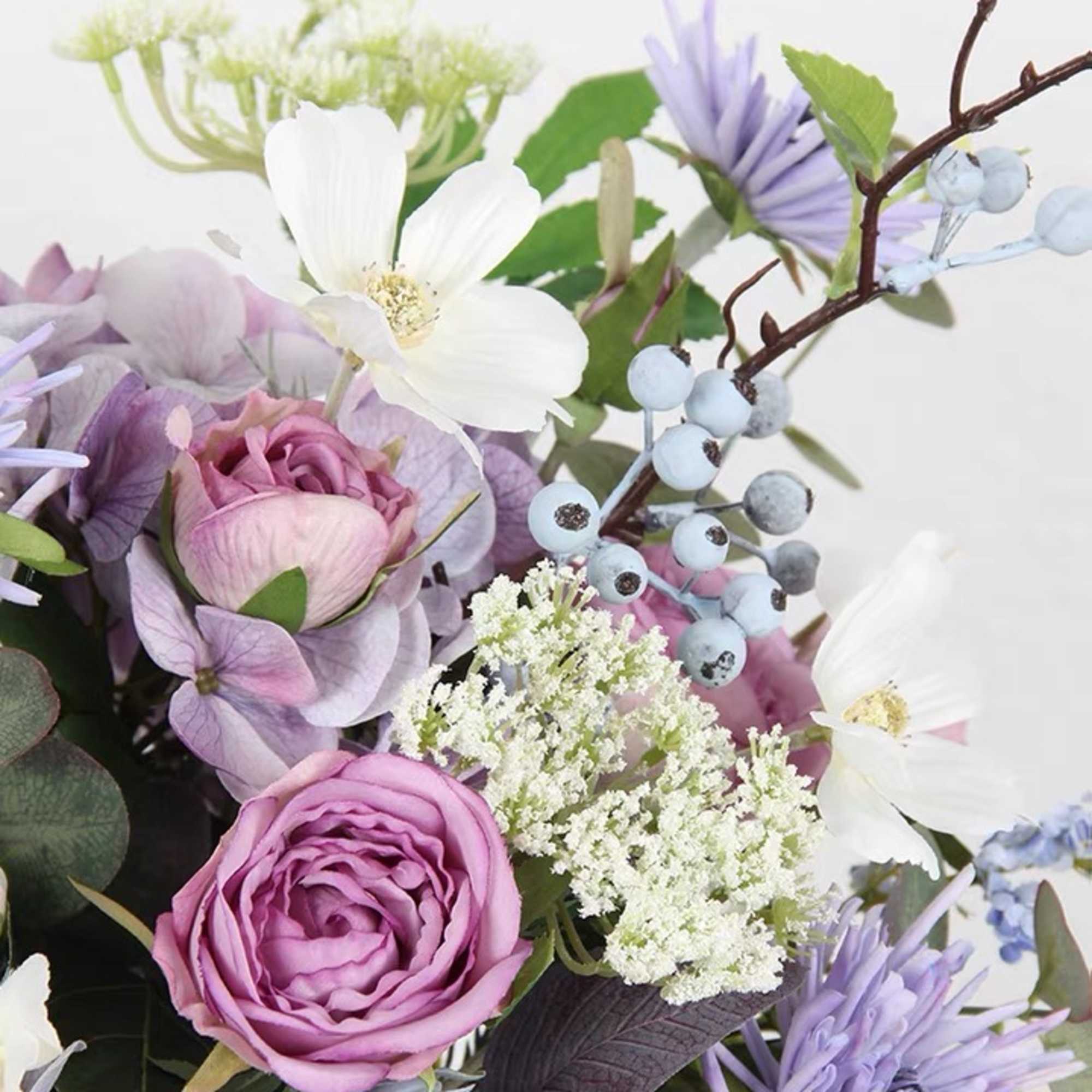 This luxurious vase arrangement features an exquisite selection of premium seasonal blooms