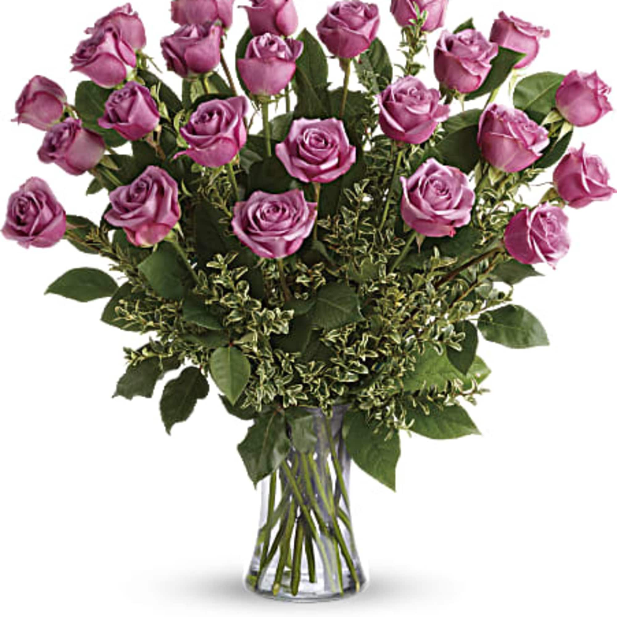 Tall arrangement of lavender roses in a clear glass vase