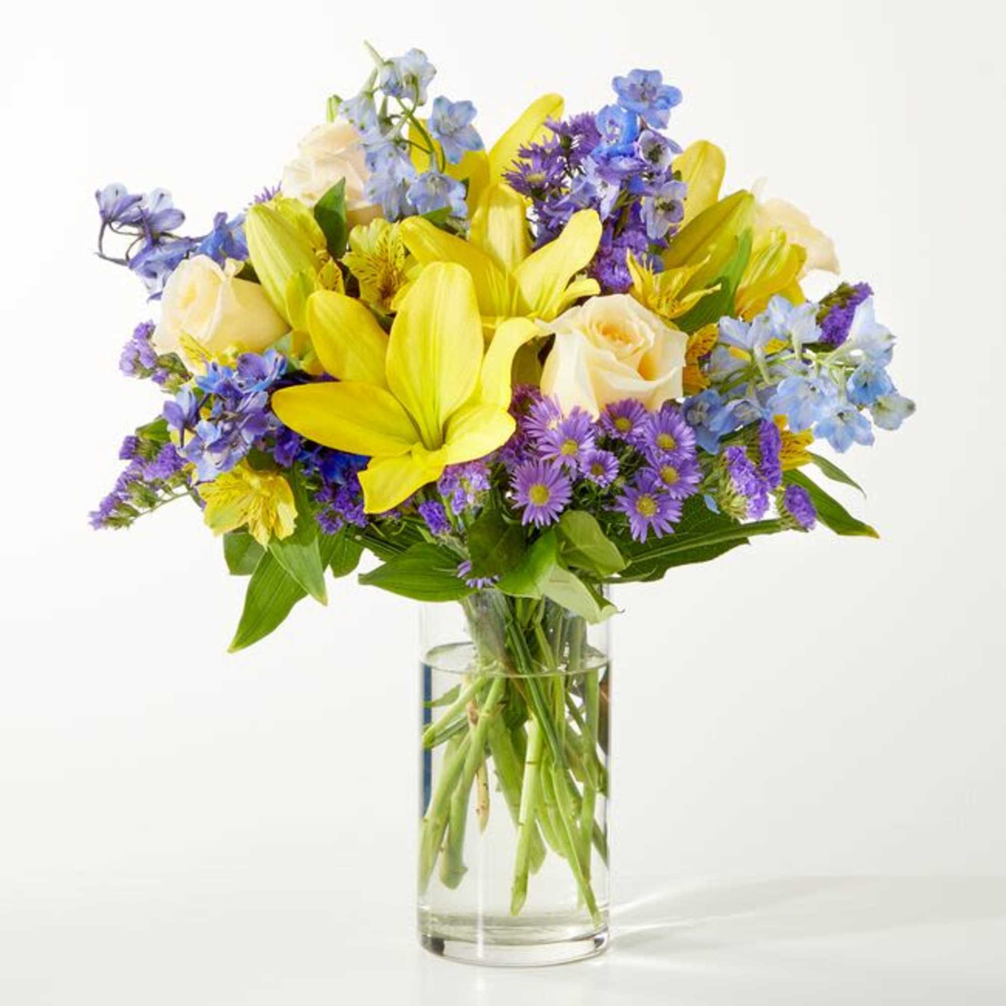 Refreshing and vibrant, this zesty floral arrangement is expertly arranged to create